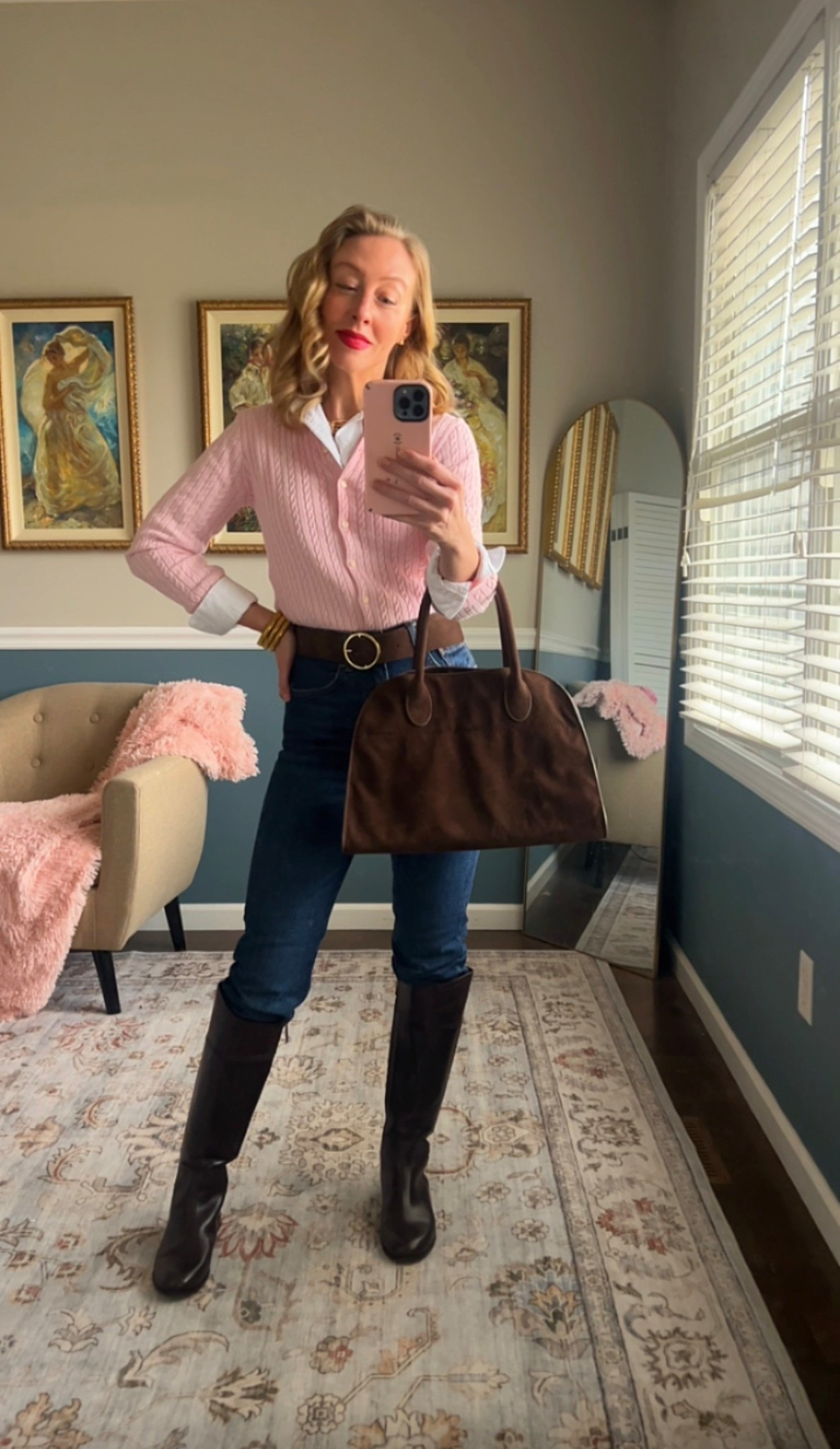 Pink cable knit cardigan layered over a white button-down, dark denim, brown leather belt, tall leather boots, and structured brown satchel.

Classic spring outfit idea for work, lunch, or everyday wear.

Timeless American style.


#LTKOver40 #LTKSeasonal #LTKootd
