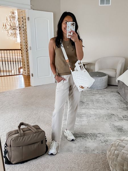 Travel outfit. Airport outfit. 
Athleisure tank top true to size. 
Athleisure pants are perfect for travel size up if in between. 
Travel bag fits under the seat in front of me on airplane. Crossbody bag is lightweight for travel. 
Sneakers are lightweight and cushiony true to size  

#LTKtravel #LTKitbag #LTKstyletip