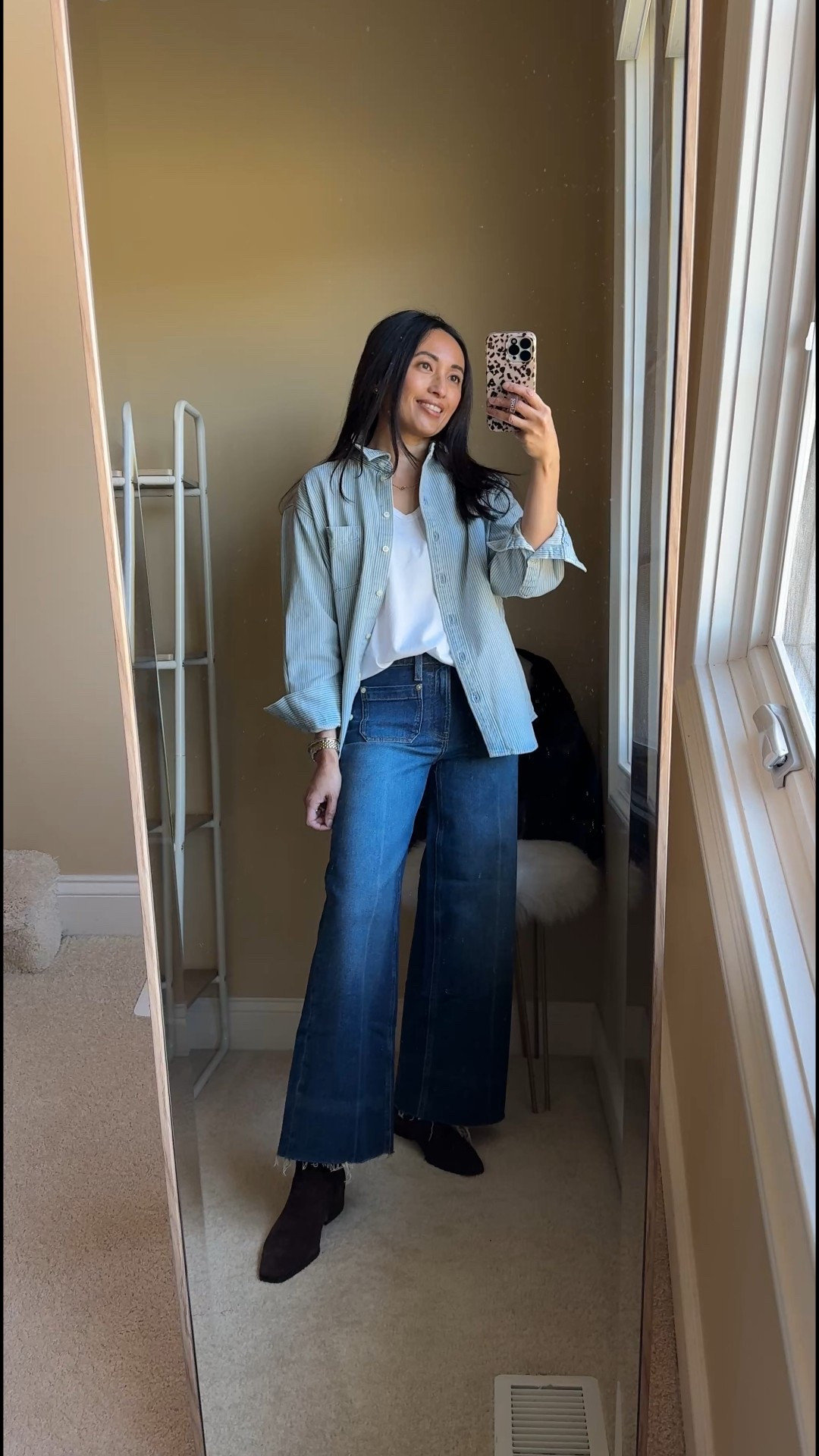 Denim on Denim outfit idea with classics from @gap #GapPartner 
Light denim shirt with dark denim jeans. Made a little more casual with a t-shirt underneath and denim shirt worn open like a jacket. Tote bag is done in faux suede and has a chic slouchy shape. 
Shirt, t-shirt, jeans, and bag are currently 50% off. 
- Exact shirt is done in their classic “Big Shirt” oversized cut and has classic railroad stripes. Material is substantial 100% cotton that functions like a jacket. 
True to size. 
- Exact t-shirt is also 100% cotton. 
True to size. 
- Exact jeans are high-rise wide-leg jeans are 99% cotton and 1% stretch. 
Showing true to size, but I could also size up  
- Exact bag is in shade chocolate cake brown. 


#LTKootd #LTKFindsUnder100 #LTKOver40