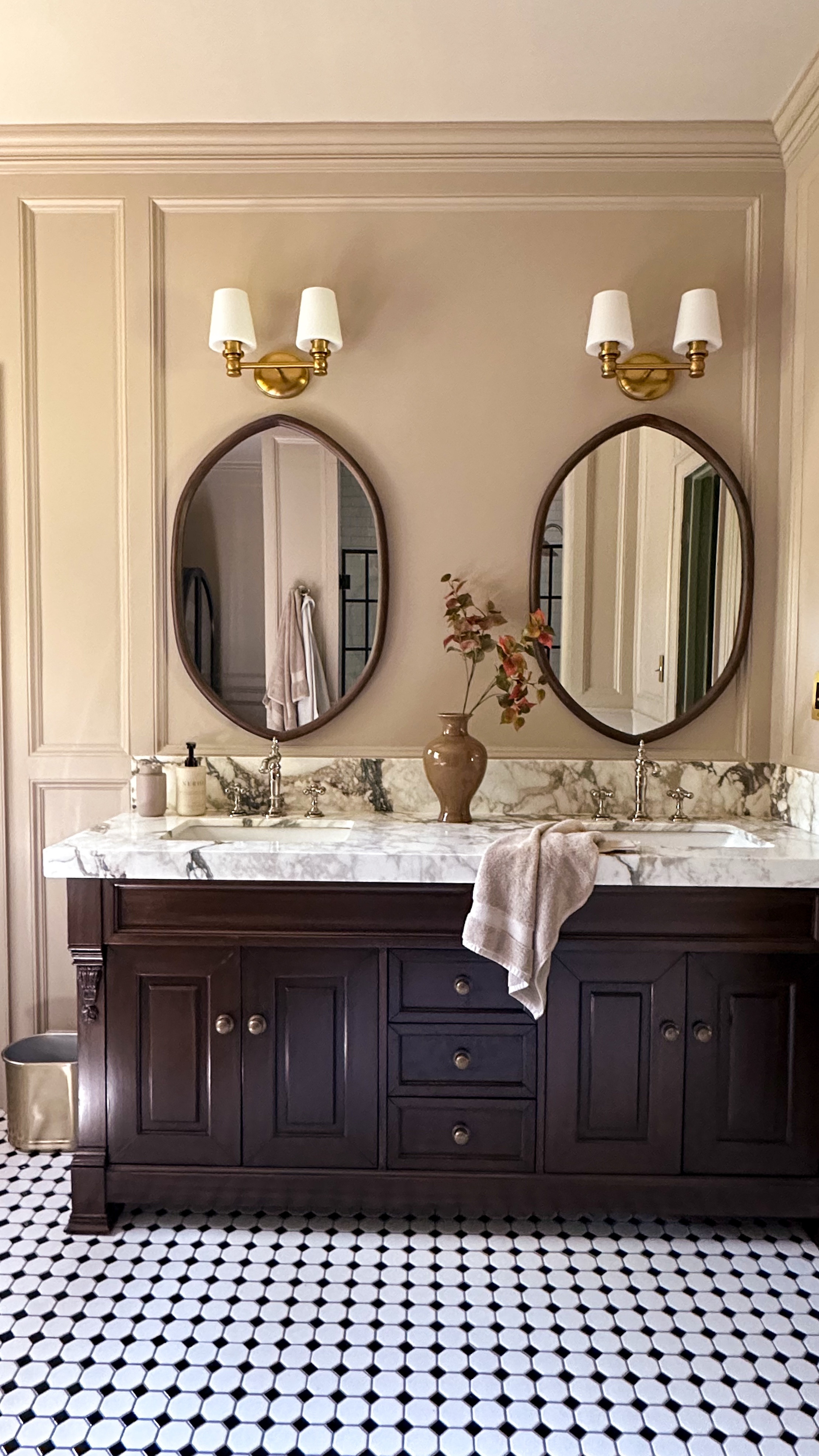 She understood the assignment 📝

When I set out to flip my primary bathroom, my main goal was to take it from cold and sterile to warm and inviting. Layered paneling, a warm paint color, mixed metals and vintage touches brought the vision to life, and added a touch of glamour.

Now it feels like a space I actually want to linger in, not just rush through. Would you go bold in your bathroom, or do you love keeping it light and bright?



#bathroommakeover #beforeandafter #diyhomeprojects #moodyinteriors #bathroominspiration #diybathroom #interiorstyling #collectedhome #interiordetails #interiordesign #vintagemodern #lovewhereyoulive

Moody | Cozy | Cozy Interiors | Moody Aesthetic | Secondhand | vintage | home improvement | renovation | traditional | interior design | design inspo | home decor | antiques | thrifted finds | collected home | thrifting | affordable decor | DIY | facebook marketplace  | FBMP | estate sales | sustainable | upcycle | Nashville

#LTKHome #LTKFindsUnder100 #LTKFindsUnder50