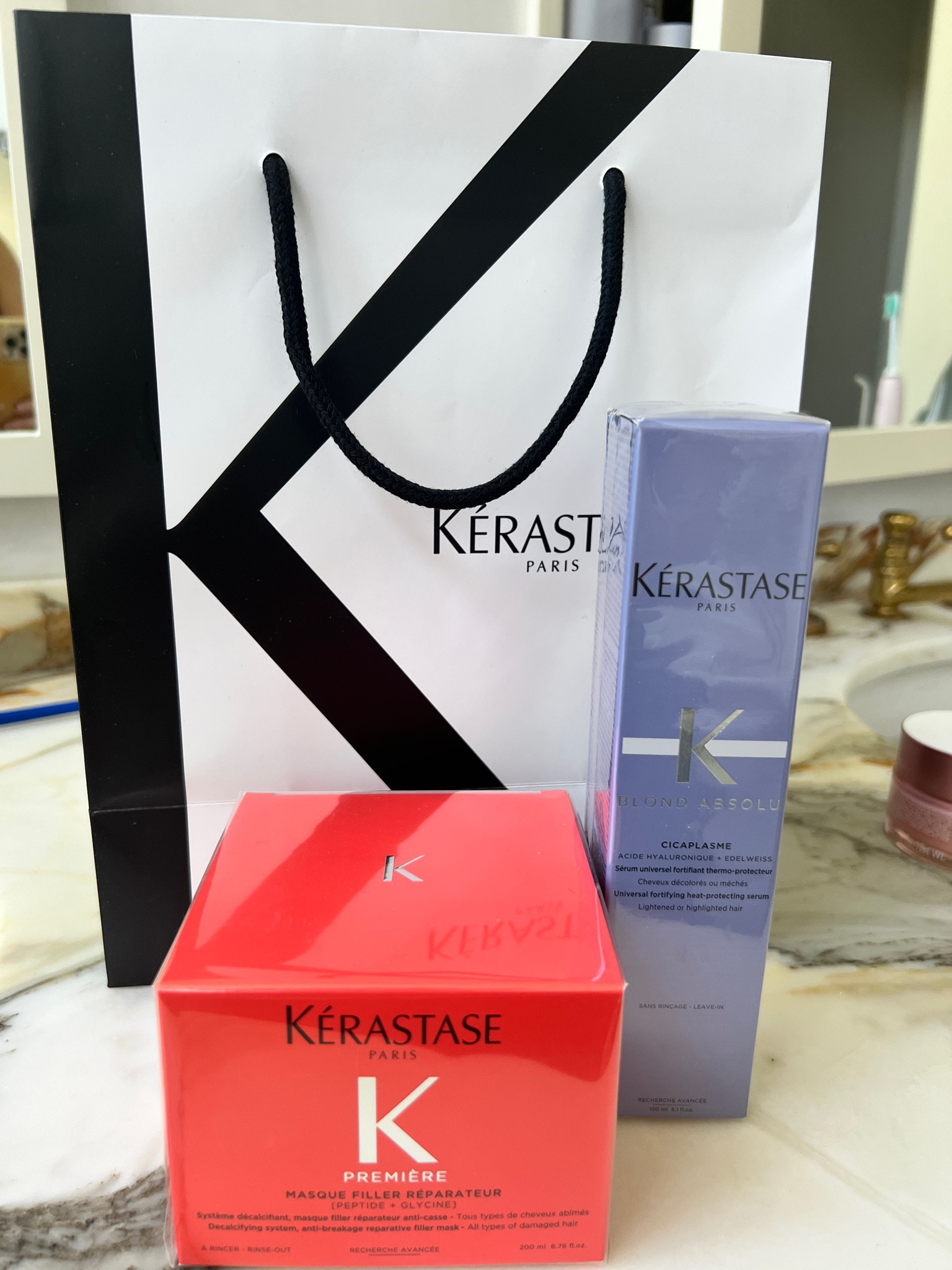 Some goodies my hairstylist recommended after my appointment yesterday. The orange box is a hair mask for damage and repair and the purple is a heat protectant that also keeps bleached hair from getting brassy. I have balayage on my ends  so there is some damage 

#LTKBeauty