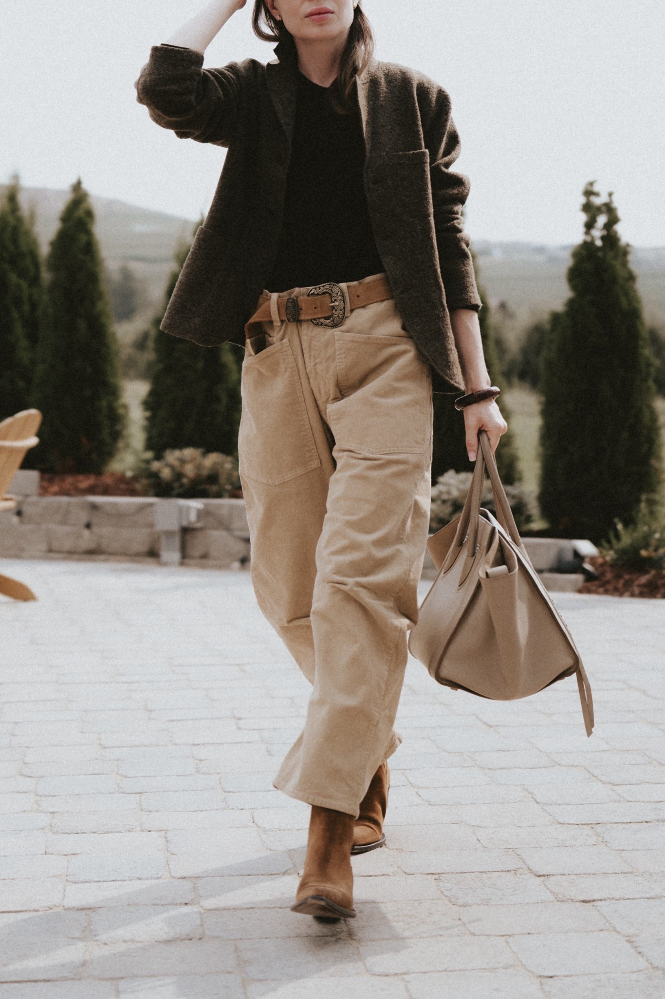 Styling corduroy barrel leg pants with suede cowboy boots + western belt + felted wool blazer. 
Bag: Celine Phantom luggage bag in taupe. 
Pants: Nili Lotan Shon
Belt: Free People
Jacket: Buck Mason 
#LTKShoeCrush #LTKItBag

#LTKootd #LTKSeasonal #LTKWorkwear