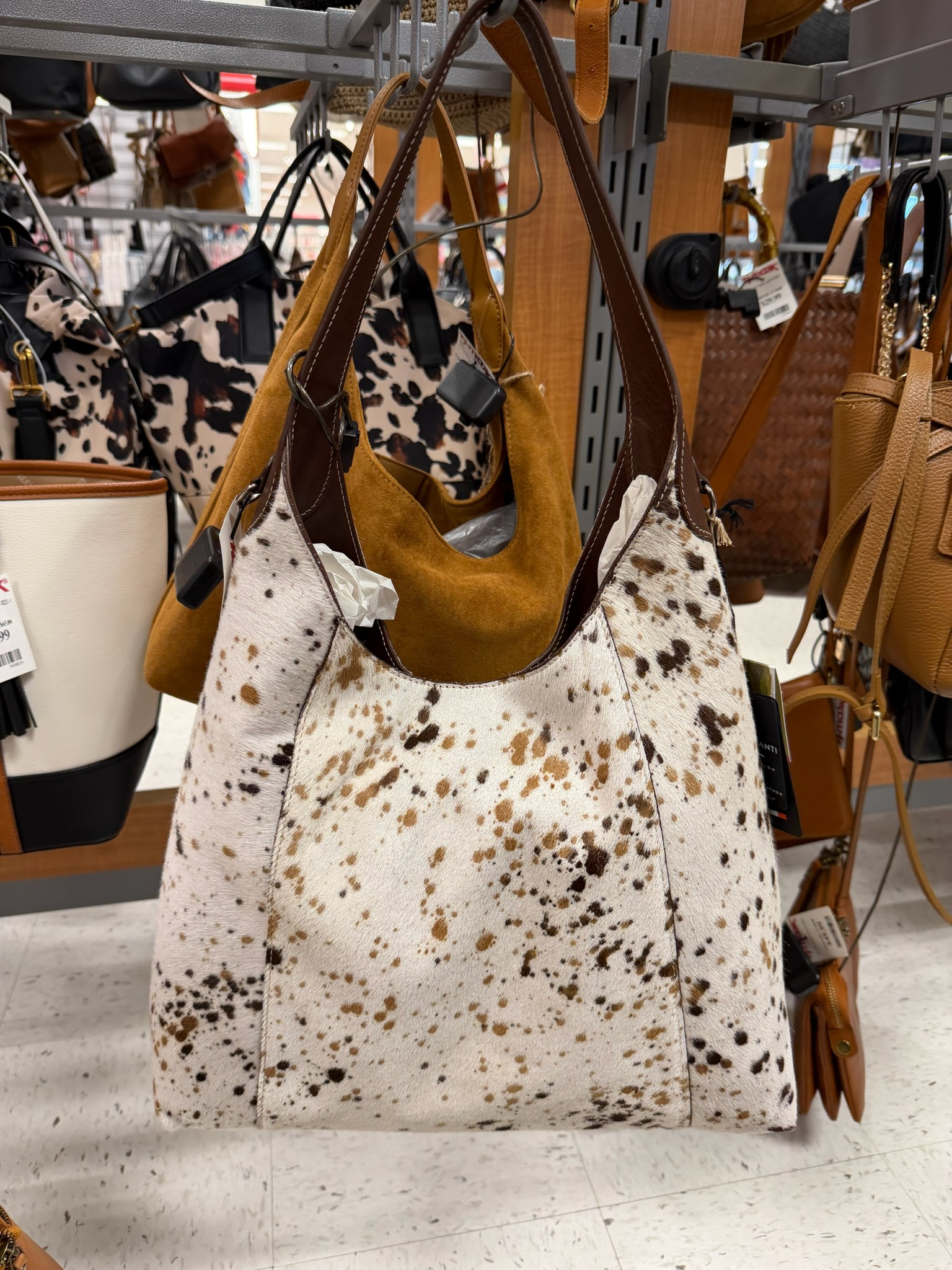 Loving this Cavalcanti leather cow print tote looks so high end for only $179.99! Such a statement bag for everyday. spring outfits 2026, spring dresses, vacation outfits beach, summer outfits, date night outfits, work outfits, plus size fashion, statement bags, designer look for less, everyday tote, cow print, tj maxx online, tj maxx 

 #LTKMothersDay #LTKootd