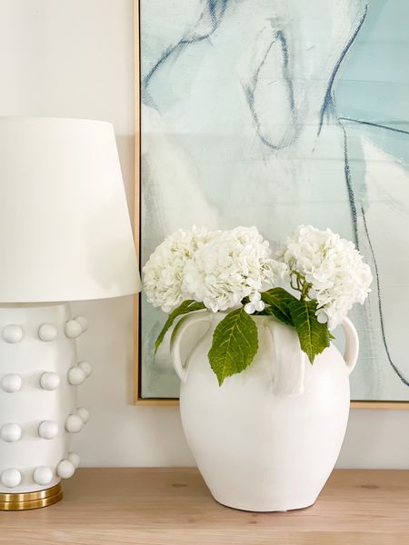 Seriously in love with these real-touch faux hydrangeas! I need to order another set for this large white ceramic vase, but they’re perfect for spring and summer decor (and come in several colors)! Also linking our long console table, abstract art and circle dot lamp!
.
#ltkhome #ltkseasonal #ltksalealert #ltkunder50 #ltkunder100 #ltkstyletip Amazon decor, favorite vase, designer lamp

#LTKSeasonal #LTKhome #LTKunder50