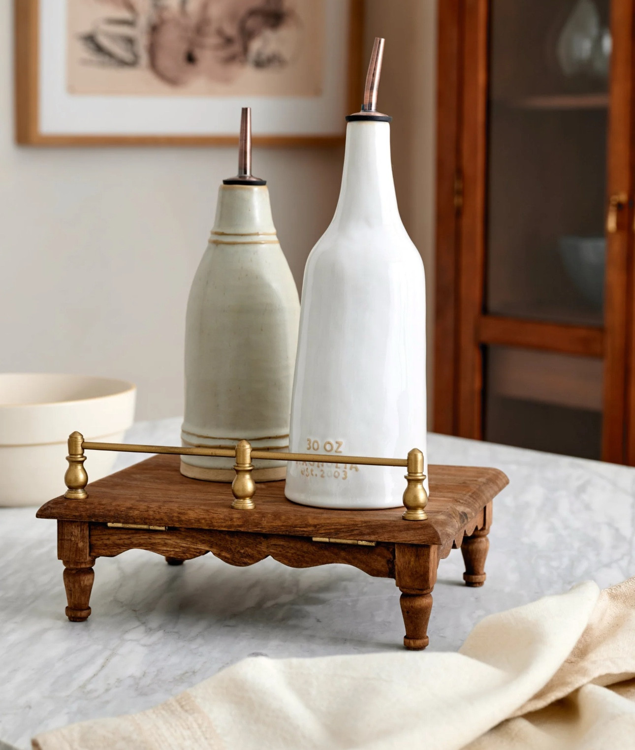 Vintage-Inspired Cookbook 
Holder + Riser
PREORDER 
I missed out on this last time when it sold out and I literally checked every week!! 
Now it’s ready to preorder!! 
Ships in 4-6 weeks! 

“This Vintage-Inspired Cookbook Holder + Riser has been elevated with turned legs, scallops, and a brass gallery rail. Its function has been reimagined for dual purpose – the top folds flat - transforming it into a riser that can be used every day. It functions with multiple notches to position stand where desired, folds down to be used as a riser, creating multi-functional opportunities of plating cuisine when guests are over.”