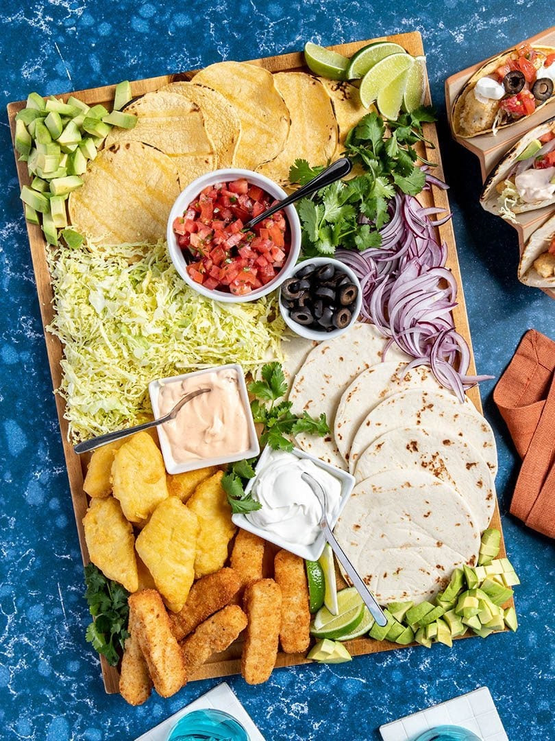 This fish taco toppings spread will be your new go-to for Taco Tuesday–and every other day of the week! I used frozen fish sticks to make this board extra speedy (and kid-friendly!), but I also love to season and grill my fish for a more elevated, Baja-style experience. For added fun, whip up some Simple Margs (alcohol optional!) or serve with your favorite Mexican soda or lager.

#LTKSeasonal #LTKfoodie