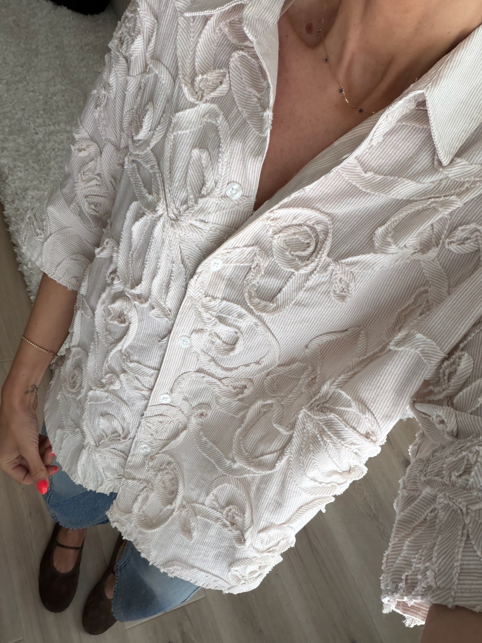 This shirt is all about the texture. The raised floral detailing gives a simple button down so much dimension, and I love it with relaxed denim and brown flats to keep the rest of the outfit understated.

Size S

textured blouse, floral button down, statement top, neutral blouse, casual fall outfit, relaxed denim, brown flats, transitional style, women’s fashion, fall outfit ideas, annabrstyle

#LTKootd #LTKSeasonal #LTKOver40