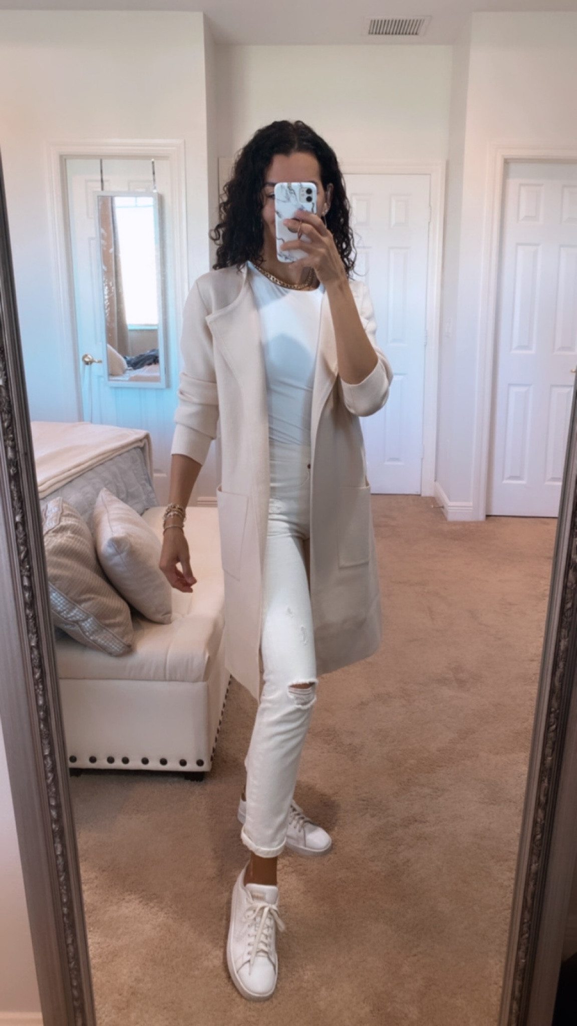 Wearing a size M in the Coatigan for an oversized fit. Size 26 in the Levi’s jeans, jeans are on sale on revolve. and S in the bodysuit. Size down in the sneakers. Casual outfit, travel outfit, layering, 

#LTKstyletip #LTKSeasonal #LTKGiftGuide