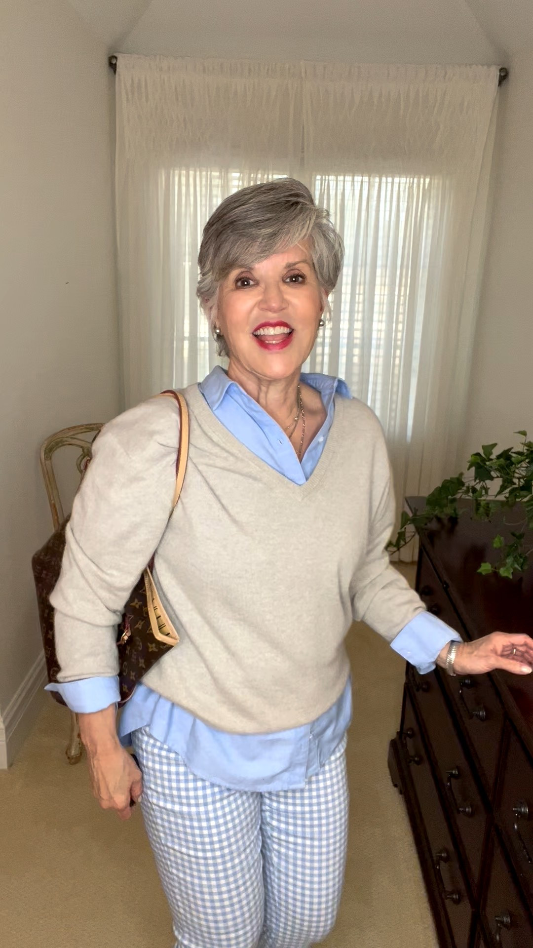 Cozy layers over pants + cashmere sweater + suede booties. A relaxed but refined look: gingham pants styled with an oversized blue Oxford cloth shirt layered under a light grey cashmere v-neck. The shirt’s cuffs, collar, and hem peek through for dimension, while grey suede booties and layered silver jewelry finish the look. Perfect for cool autumn 🍂 days.

#LTKSeasonal #LTKOver40 #LTKFindsUnder50