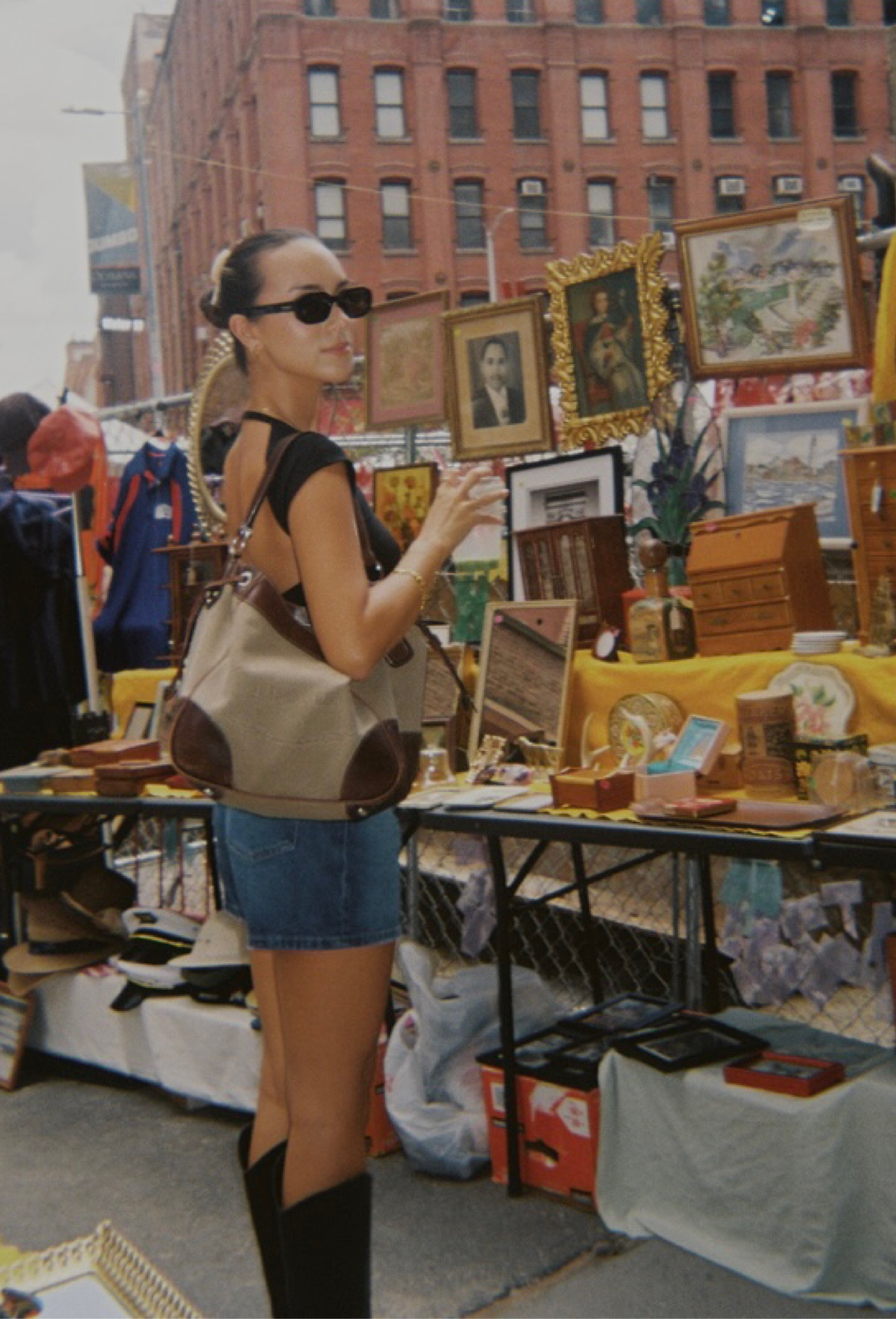 🇺🇸 Dumbo Brooklyn flea market aesthetic - open back backless black top + dark wash denim shorts + vintage prada shoulder bag + black knee high cowboy boots + black 90’s rectangular sunglasses 

#LTKfindsunder50 #LTKstyletip #LTKtravel