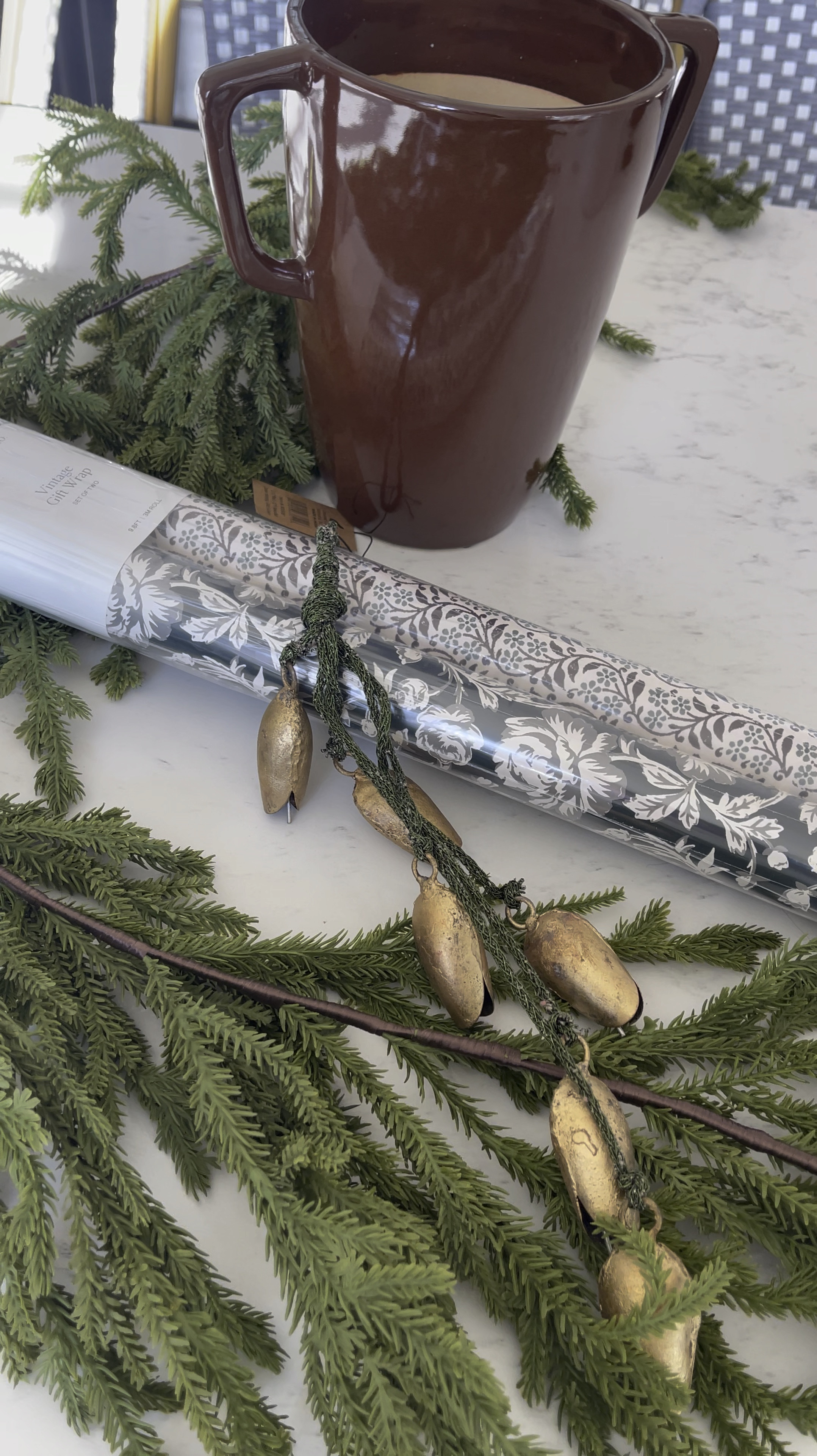 McGee & Co Christmas !
Vase, Vintage wrapping paper, hanging bells

#LTKSeasonal #LTKHome #LTKHoliday