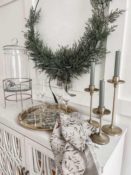 Holiday bar cart styling


Hoop wreath brass candle holders gold taper candle holders drink dispenser gold tray two door accent cabinet holiday decor Christmas decor 

#LTKunder50 #LTKhome #LTKunder100