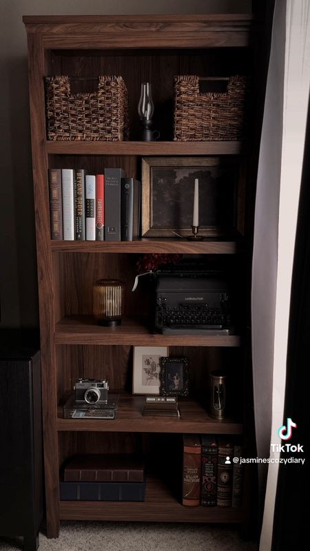 i’ve imagined having a bookshelf in this corner of my apartment since the first month we moved in but for various reasons i kept putting it off. now that it’s finally up i can’t keep my eyes off of it! 📓🕯️🪵🫶🏻 

#newbookshelf #decoratewithme #bookshelfdecorating #bookshelfdecor #vintagestyle #vintagehomedecor #vintagevibes #vintageaesthetic #stylingbookshelves #bookshelfdecor #bookshelfstyling #moodyaesthetic #darkhomeaesthetic #moodyhomevibes #darkhomedecor #moodyvibes  #cozyhome #cozyhomedecor #moodyhomedecor #bookshelfinspo #moodyhomedecor #cozylifestyle #moodyhomeaesthetic

#LTKMostLoved 

#LTKhome