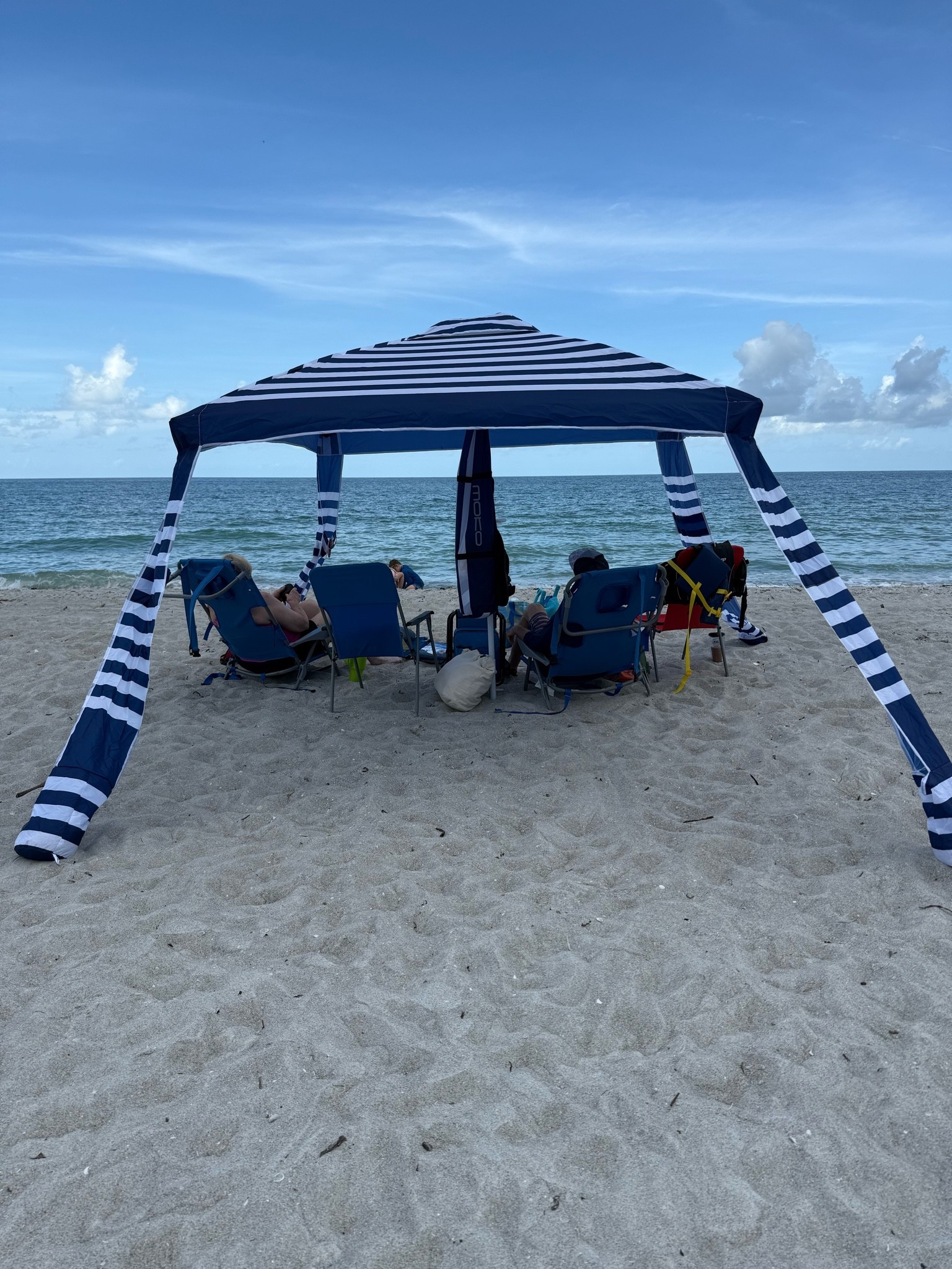 We saw another one of our umbrella tents on the beach today. After a year, I would still recommend it. We had a playdate at the beach with another Mom and her son. Her and I were able to carry this out, put up, take down, and pack up without any hassle. It also rained for a little bit and we stayed dry and happy until the storm passed.

#LTKSeasonal #LTKmomlife