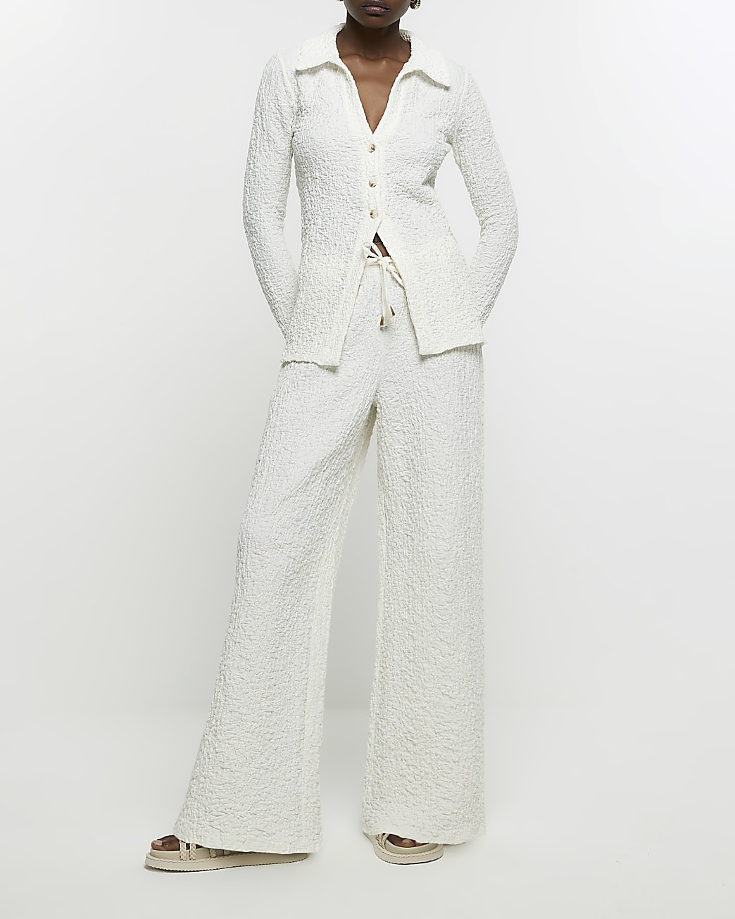 Cream wide leg textured trousers | River Island (US)