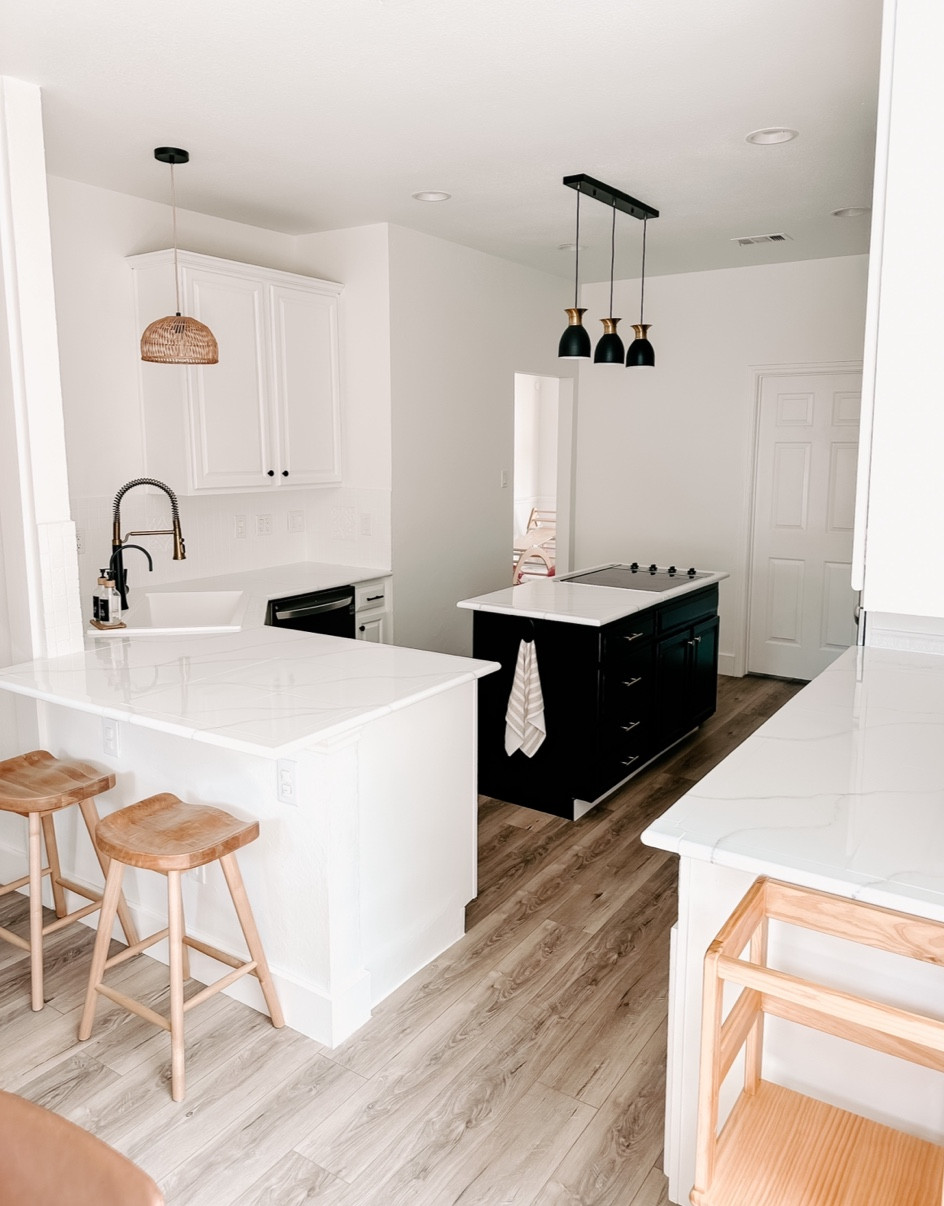 It’s been 2 years of little updates here and there, some of it by choice, but most of it replacing things that have unexpectedly broke or leaked or stopped working. Such as: appliances, our sink, lights etc lol.
.
I had a full vision to gut the whole thing, change the layout and start from scratch. But the little fixes here and there and the tight space we’re working with, made it make more sense to do the best we could with the layout we were given. 
So I put on my best DIY hat and painted the cabinets, backsplash, countertops and replaced the hardware. 
Called in a plumber for the sink & faucet, a few friends to do the lights, and changed out each appliance that died on us and here we are with our completed little DIY kitchen refresh - and I honestly couldn’t be happier with it! 🤩
Probably should’ve chose a better time to tackle this project other than my 3rd trimester, but hey, whatever it takes to motivate you right? 😂
.
Linking everything that I could in my bio ❤️
.
#kitchendesign #kitchenmakeover #diykitchen #homeprojects #nesting #beforeandafter 

#LTKSeasonal #LTKhome #LTKfamily