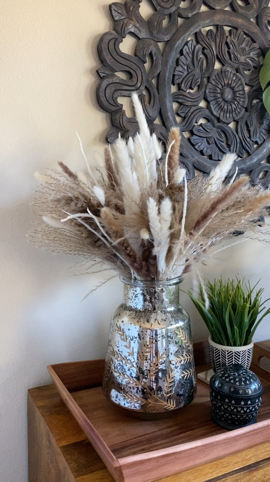 These pretty dried pampas grass stems are a great price. They come in the smallest box and I was worried but I followed the instructions and they are gorgeous!  I bought only 1 pack of 96 pieces. They are giving off neutral boho vibes and I’m loving them in my bedroom decor. They would be perfect for wedding table styling or decor as well!


#LTKHome #LTKStyleTip #LTKWedding