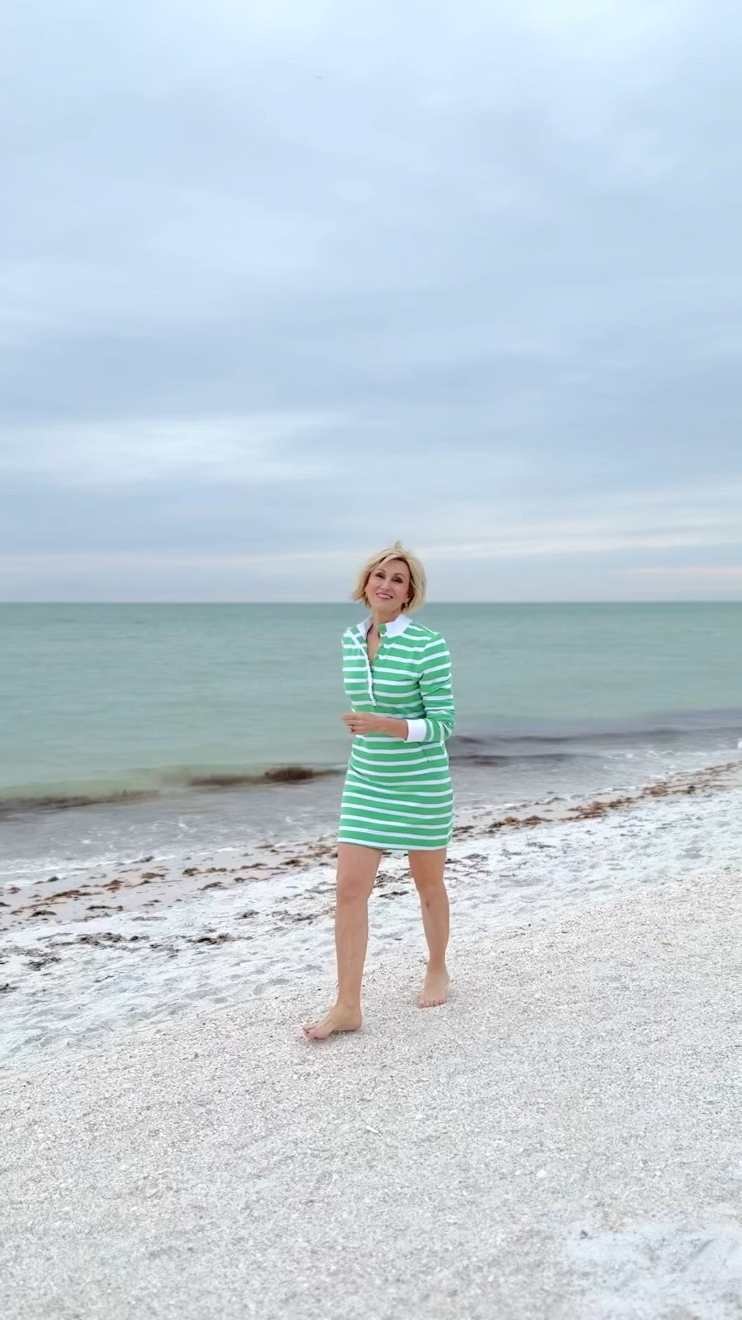Salty breeze, sandy toes, and effortless stripes. 🌿🌊 This green and white dress from @lilypulitzer is the perfect blend of breezy and chic—light, airy, and just right for a seaside stroll. 
🌊Scroll down to shop & follow for more

#CoastalChic #EffortlessStyle #BeachsideElegance

#LTKOver40 #LTKWatchNow #LTKSeasonal