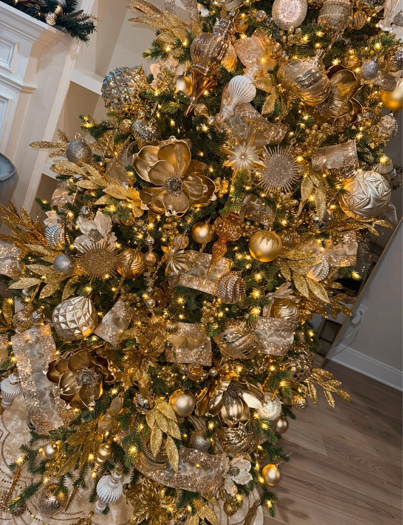 My gold X champagne Christmas tree last season ✨ 

I tried counting, and I think I estimated 350-400 ornaments total on this tree from last year! 🤪🎄shop most of them here! 🫶🏼

#LTKHome #LTKHoliday #LTKSeasonal