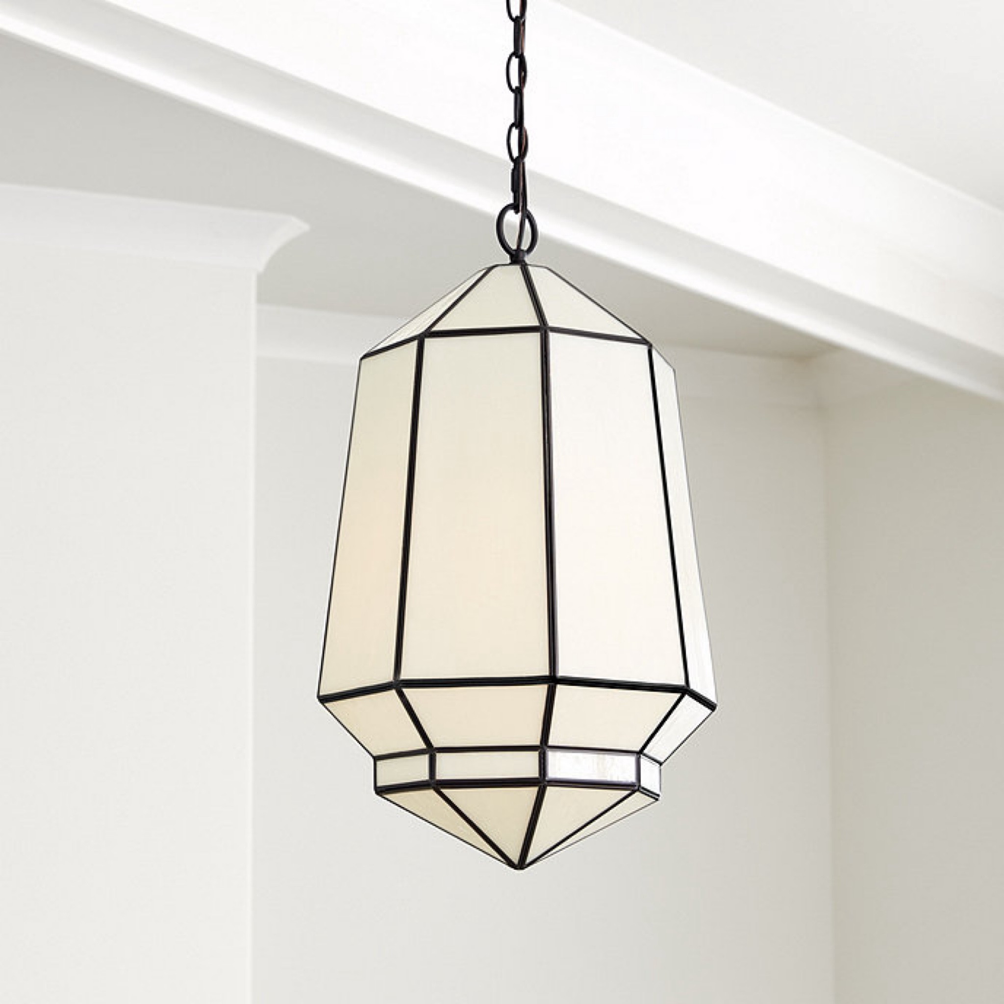 Morrocan-inspired milk glass pendant. This affordable lighting brings drama abd is especially striking in an entry, powder room, small stairwell or even as kitcheb pendants.  The graphic hexagonal frame is crafted of steel and fitted with tapered panels of glass to create a warm inviting glow. You can hang this lighting on a sloped ceiling.

#LTKhome