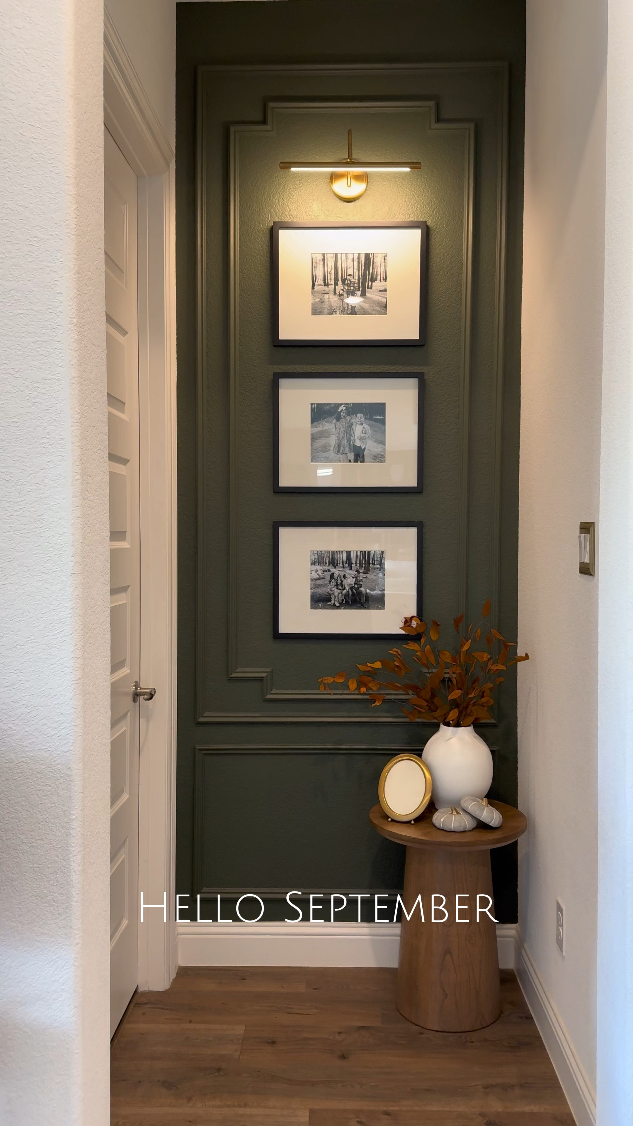 September in this little hallway nook, fall styling, fall decor, home decor, accent table, picture frames, gallery wall, bold walls, bold colors, trim work, accent wall , picture light, fall stems