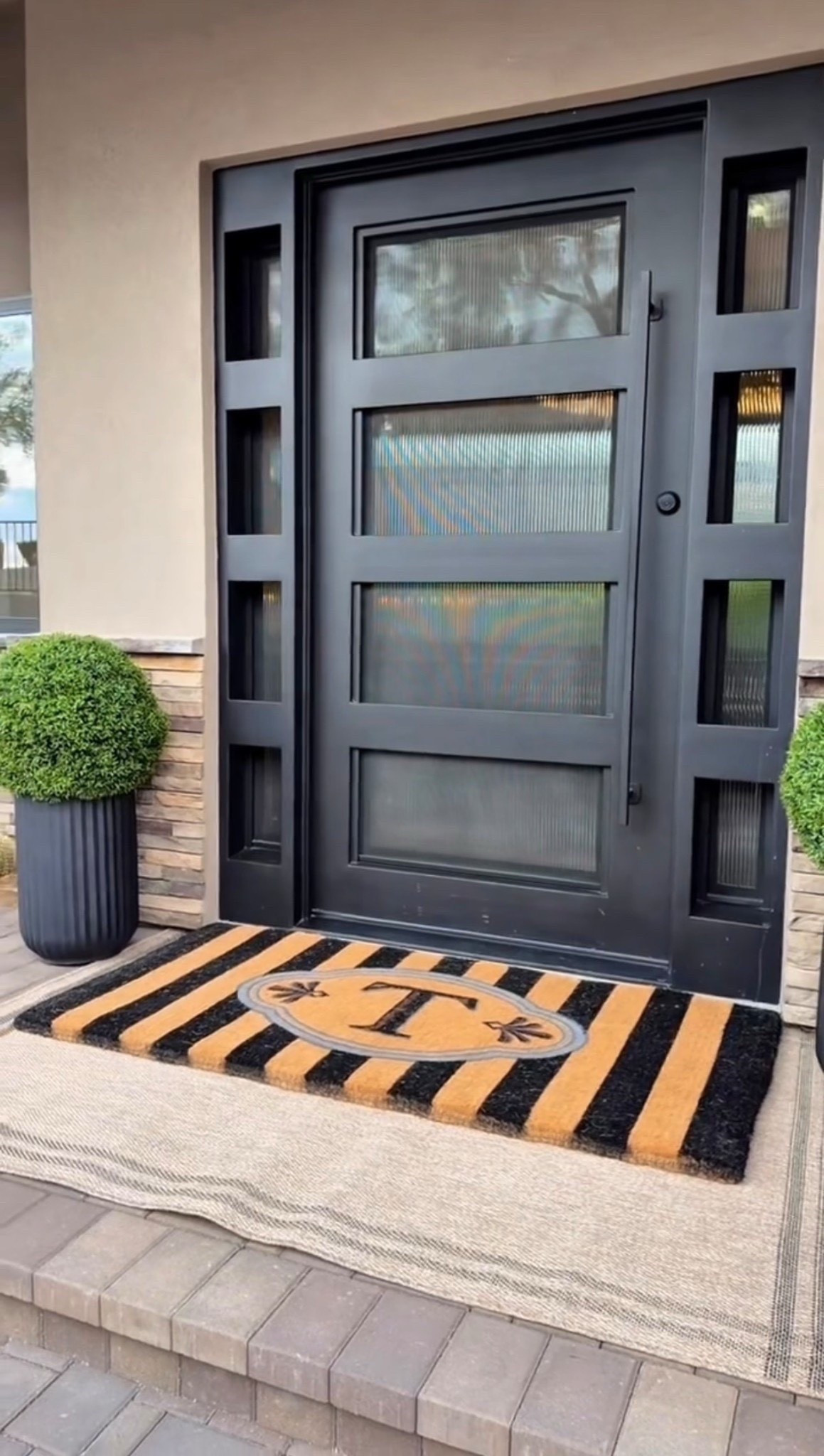 A simple porch setup. Classy and clean 🤍

Spring porch styling with structured topiaries, fluted pots, and an oversized front porch rug to anchor the entry. 

spring porch decor
front door porch styling
porch entry ideas
oversized front porch rug
fluted planter pots
topiary front porch
neutral porch decor
classic front entry design
minimal porch styling
elevated outdoor entry

#summerthompsonstyles


#LTKdayinmylife #LTKHome #LTKU