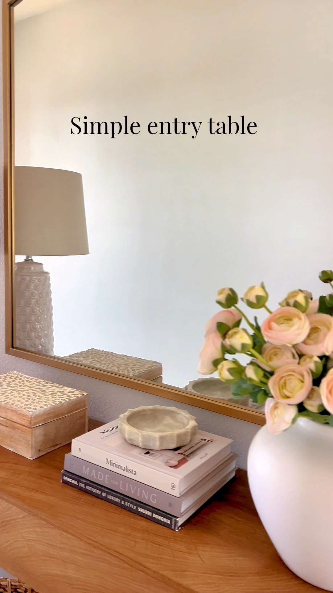 Simple entry table styling with neutral decor and soft spring florals for a fresh touch. A mirror for light, layered books for height, and timeless pieces that keep it balanced. Everything is linked.

#LTKHome #LTKSeasonal
