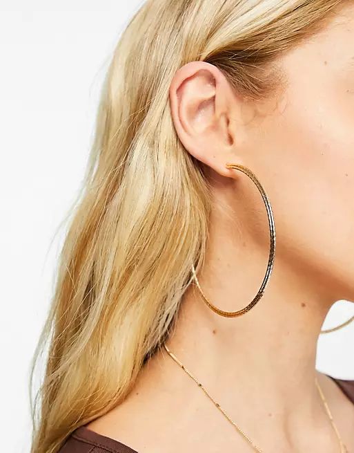 ASOS DESIGN 80mm hoop earrings in skinny twisted design in gold tone | ASOS (Global)