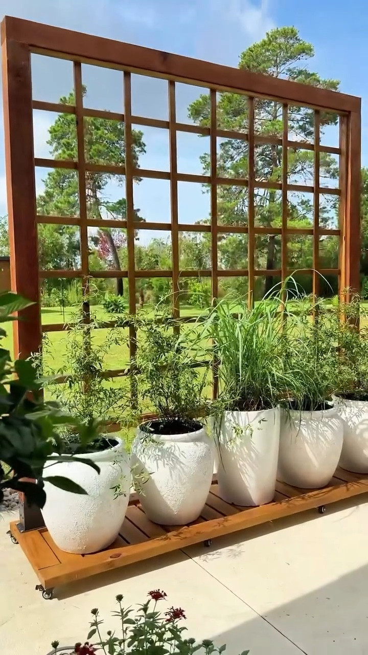 Planters, trellis, portable DIY trellis, moveable privacy screen, portable privacy screen, sliding trellis, sliding privacy screen, diy patio decor #diy #outdoors #patio

#LTKSummerEdit #LTKHome #LTKSeasonal