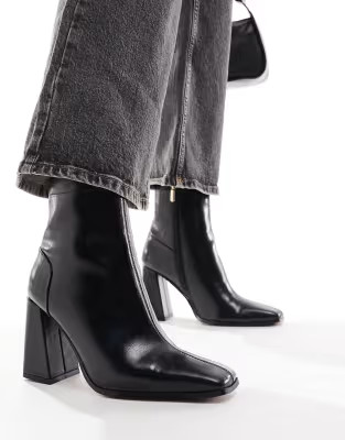 ASOS DESIGN Everest flared heel boots in black | ASOS (Global)