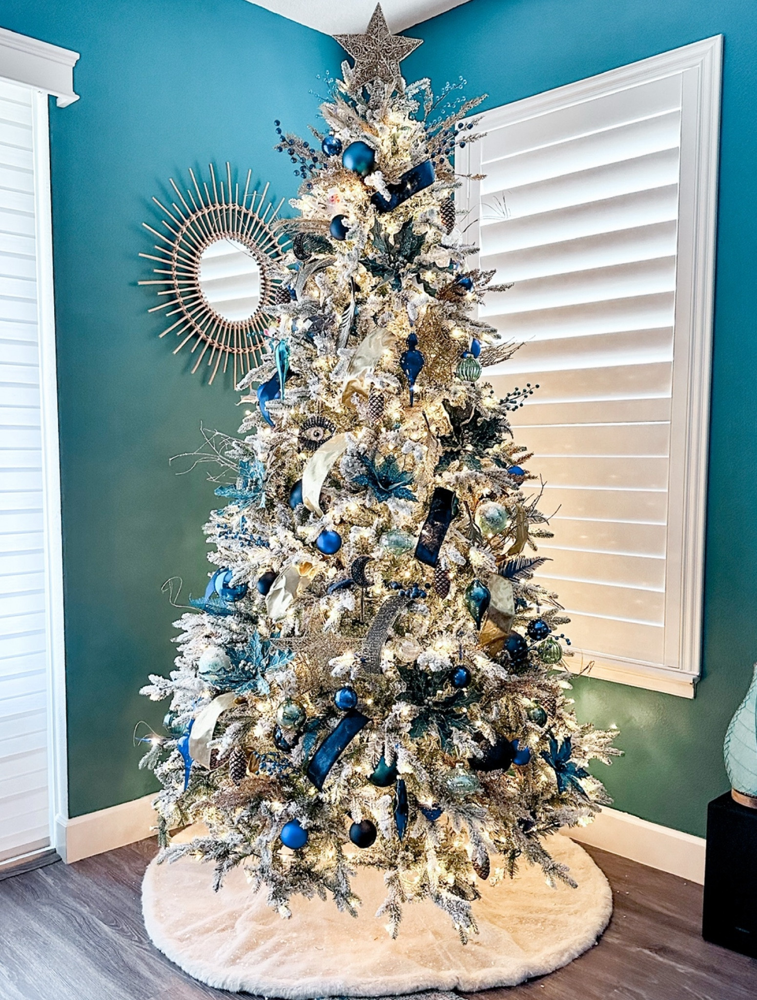 Blue and gold flocked Christmas tree #kingofchristmas #flockedtree #blueornaments #christmadecor #chrsitmastreeideas #christmastreeinspo #fauxfurskirt #treetopper #treeskirt #blueandgoldchristmastree 

#LTKSeasonal #LTKHoliday #LTKHome