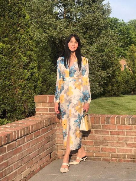 This elegant, lantern sleeve dress is the perfect choice for spring events and summer vacation evenings out! I absolutely love the artistic floral print and the color blend. The fabric is light but not see-through, and the straight fit with waist trim, button accent, and front slit is flattering and comfortable without being too bodycon!
