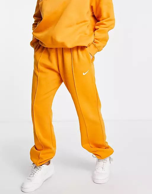 Nike Collection Fleece loose fit cuffed sweatpants in mustard | ASOS (Global)