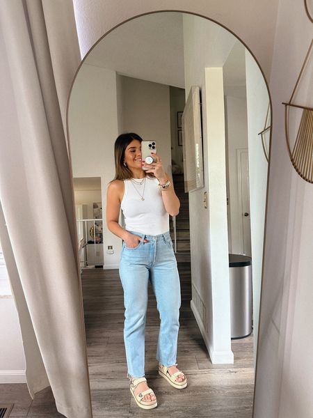 I own this white tank top in almost every color! It’s so good and it’s only $8! 
Tank top size xs
Jeans size 25
Take 25% off my sandals with code “beachday” 

#LTKFindsUnder100 #LTKSeasonal #LTKFindsUnder50