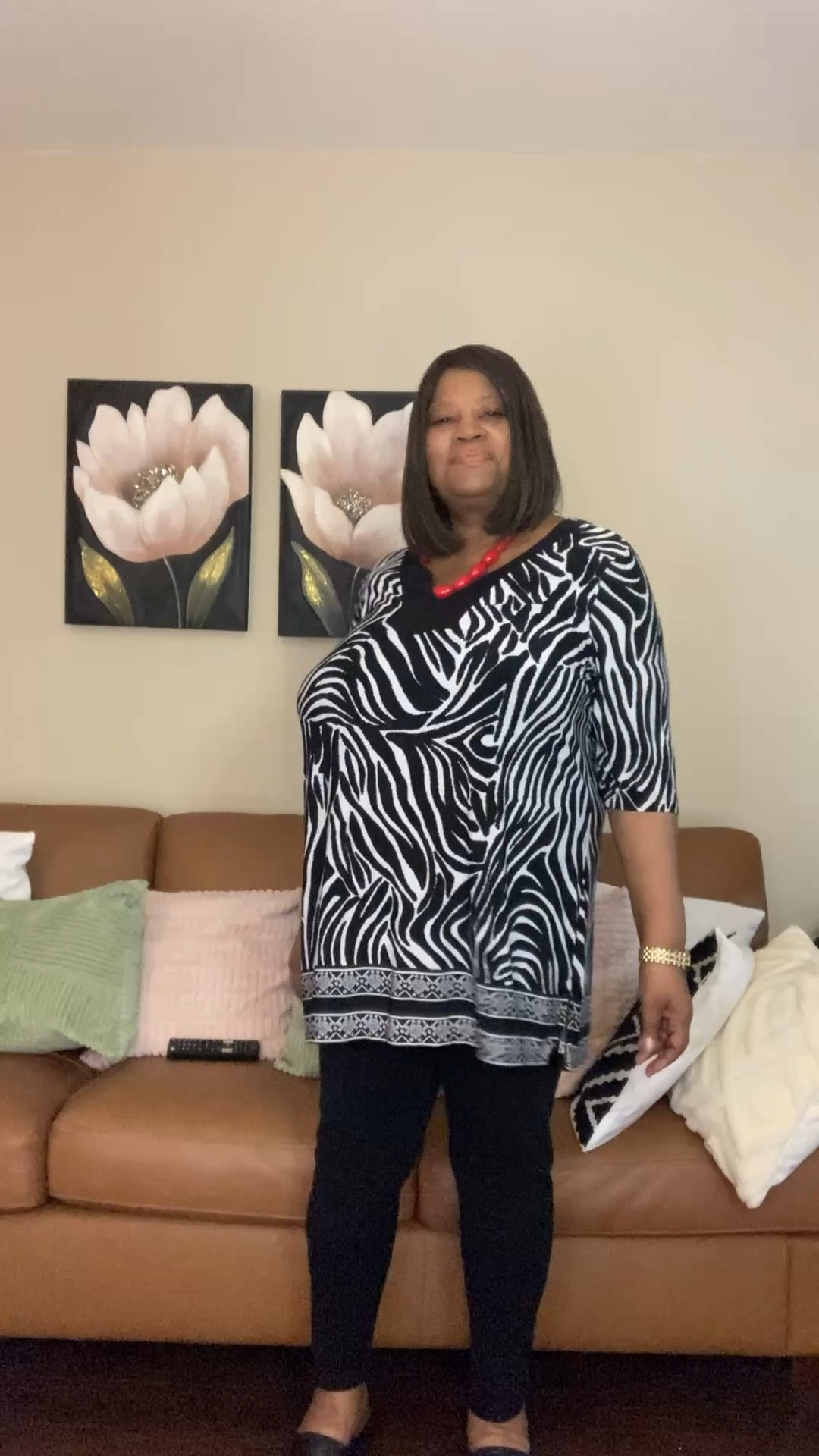 Beautiful plus size zebra print tunic top and black leggings. A cute look for women 50 and older. This tunic top is very comfy    and it has great coverage. I am also wearing a red beaded necklace with this outfit. This is and Inspo look. I will be listing similar items for this look. #ad #ltk #ltkplussize #sustainablefashions

#LTKootd #LTKPlusSize #LTKOver40
