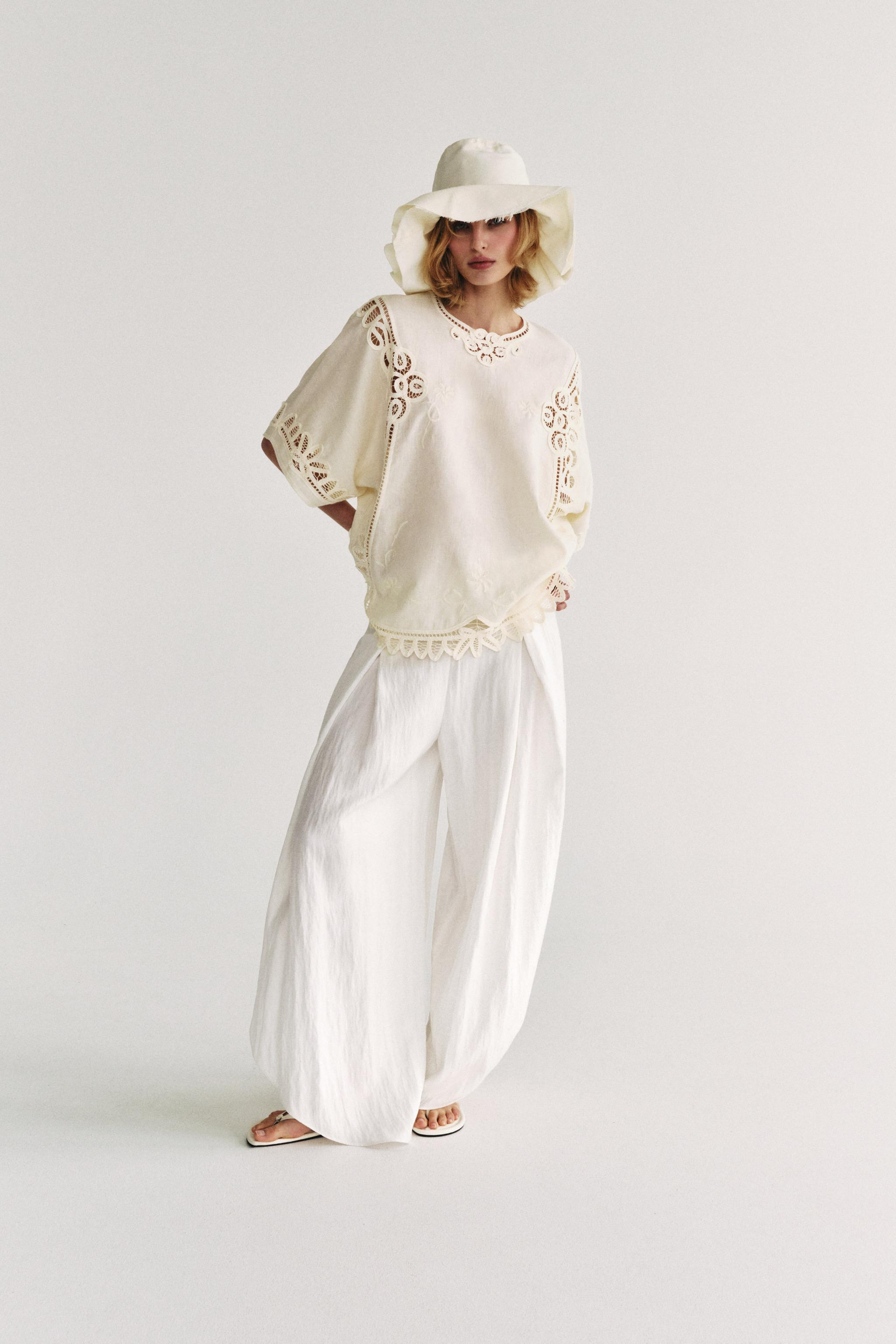 ZARA WOMAN COLLECTIONBlouse made from a linen blend yarn. Round neck and sleeves falling below th... | Zara UK