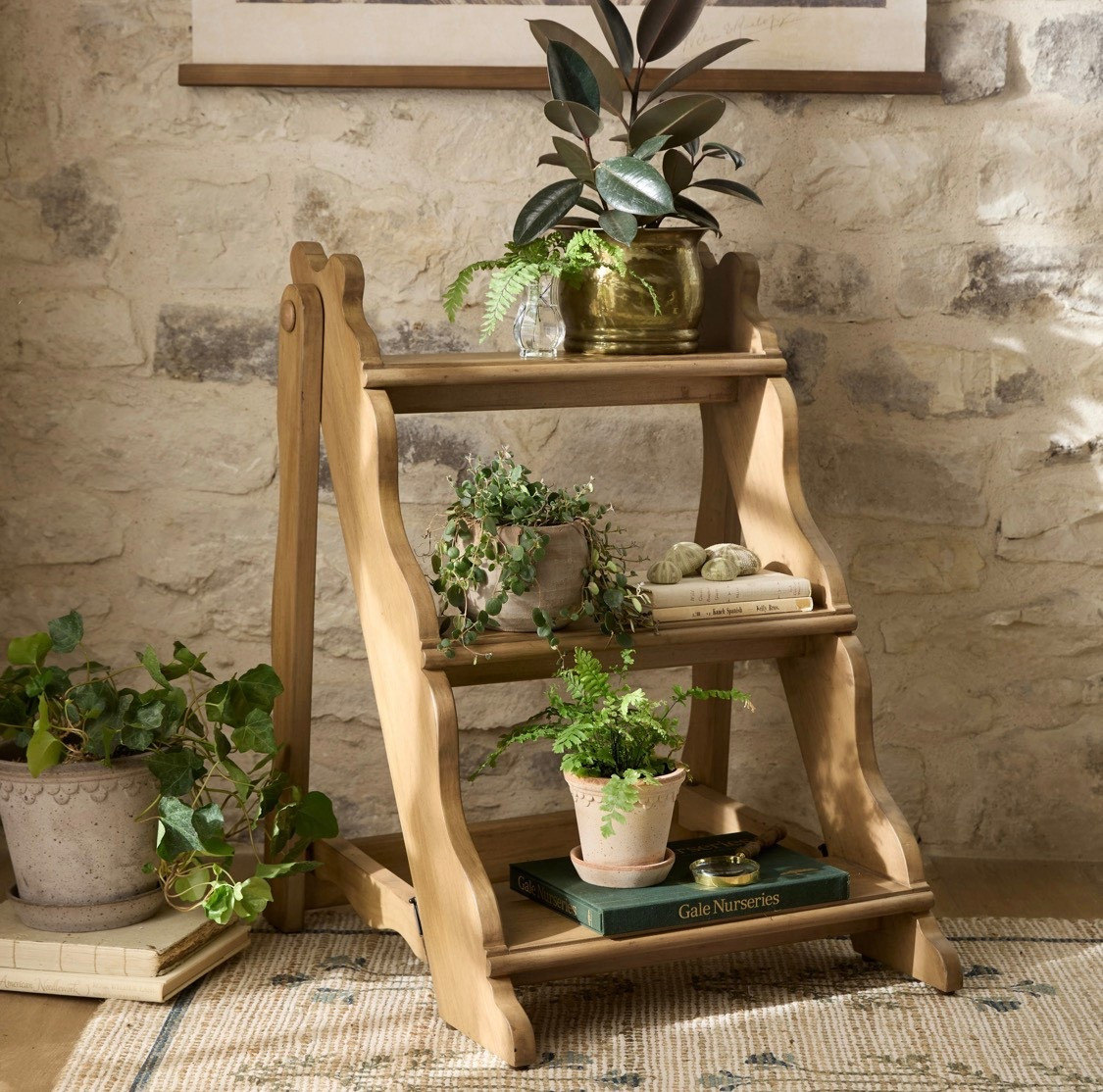 The Vintage-Inspired Plant Stand brings timeless charm and thoughtful functionality to any space. Made from solid oak wood, its tiered shelves provide an elegant display for herbs, potted plants, or small greenery. Designed with a folded stand for added sturdiness, this piece combines durability with classic style, making it a versatile addition to your home’s decor.

#LTKSeasonal #LTKHome