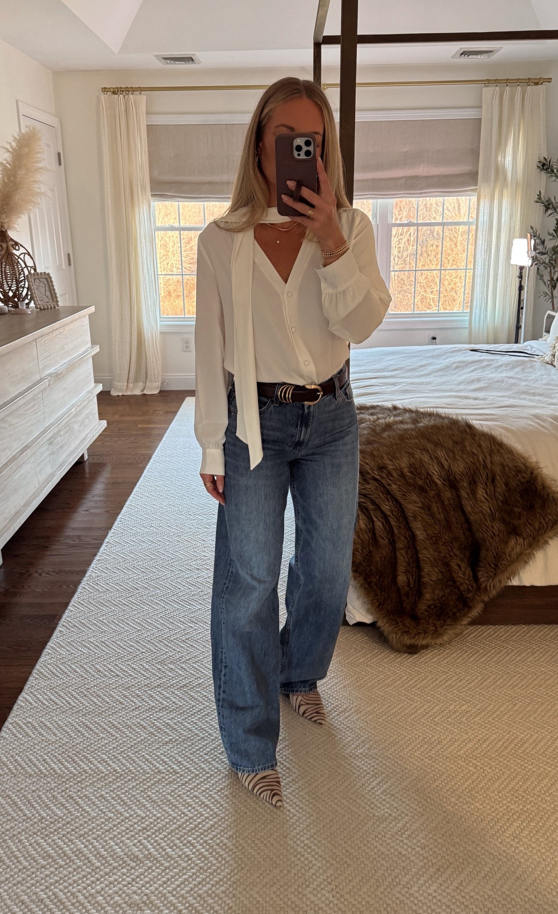 Aritzia tie neck top with aritzia, low rise, baggy jeans, their black five day sale is coming soon!

#LTKCyberWeek #LTKHoliday #LTKGiftGuide