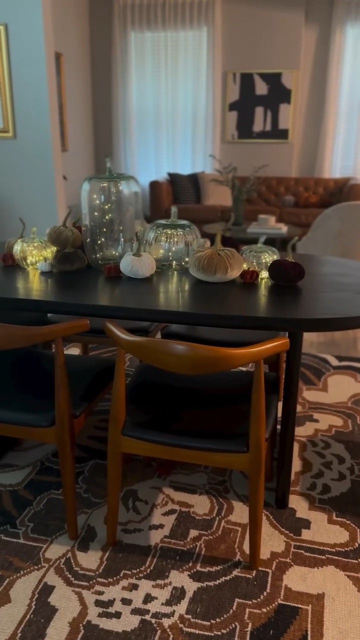 Moody Fall tablescape 🍂 

Using rich velvet brown, burgundy, burnt orange, and champagne colored pumpkins help to make my dining room feels more dramatic. This is very simple I am just layering pumpkins I found @homegoods and pumpkin cloches I had from @potterybarn. I got string lights on @amazon and put them in the cloches and secured them with @together.with.scotch and that’s it. The difficult part is balancing the sizes and color but play around with it and you’ll find what looks best. It’s hard to get this wrong.

I hope you found inspiration in my Fall themed table decor. I’ll see you later ✌️ 

#fall #autumn #falldecor #autumndecor #diningroom #diningroomdecor #falltablescape #falltabledecor #tabkescape #homedecor #moodydecor #velvet #pumpkins #pumpkindecor