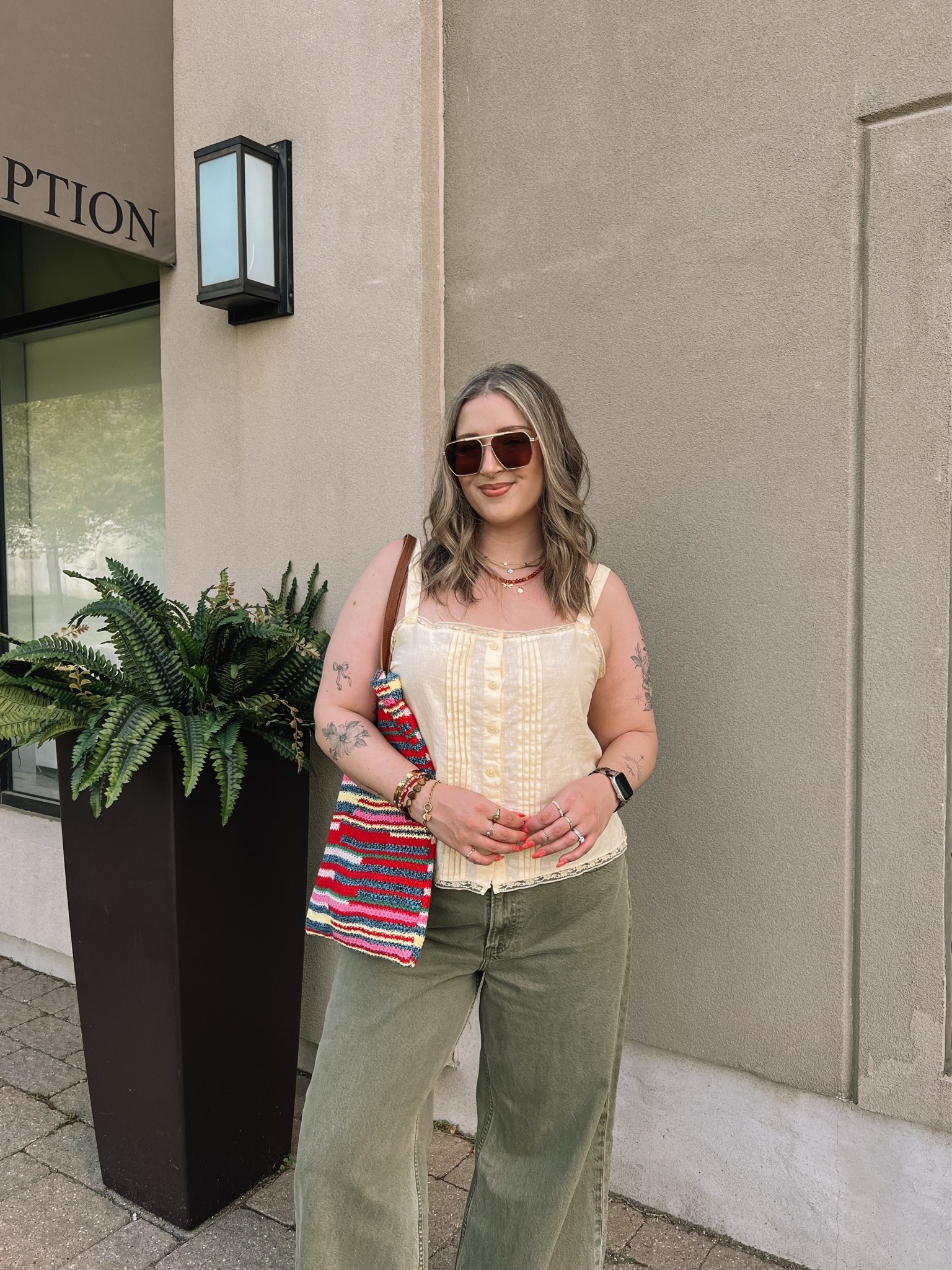 Colorful summer outfit! Wearing my usual L in the butter yellow tank top. Wearing 32 long (should have done 31) in the jeans. Also cut the hem for a custom length! Canadian top & bag links under “similar products”.

#LTKjeans #LTKsummer #LTKmidsize