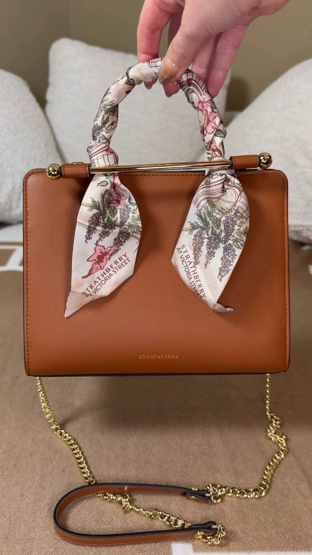 Unboxing the Meghan Markle bag from Strathberry 😍Comment SHOP & I’ll dm you the link 💗

I went to Edinburgh to shop this royal approved bag brand 😍 

Years ago I saw Kate Middleton carrying and Meghan Markle carrying these Strathberry bags and I loved the signature golden bar which I learned was inspired by vintage sheet music that the founder found in their town home in Edinburgh.

Stratherberry is an Edinburgh based luxury leather brand and these bags are not only beautiful but Amazon quality! I knew I wanted a nano mosaic or a tote but but when I got to the store I couldn’t decide because there were so many other beautiful options as well 😍

The tote comes in a nano, mini, midi, and regular size white the mosaic comes in either nano or regular.

They had the cutest leather bag charm too including a Nessie charm and highland cow. I each strathberry location also has an exclusive silk Twilly that you can only get in store so you know I had to get that! 

Which bag do you think I got?!

Strathberry bags, strathberry midi tote, nano mosaic Kate Middleton style Meghan Markle style

The perfect in-between. Inspired by a vintage music folio discovered by our founders, the Mini Tote introduces a highly requested size, bridging the gap between the Nano and the Midi. Defined by its understated silhouette, this timeless design features the signature Music Bar closure that elegantly secures the top handle. Handcrafted with versatility in mind, it can be carried by hand or styled crossbody with the detachable chain strap—ideal for everyday elegance.