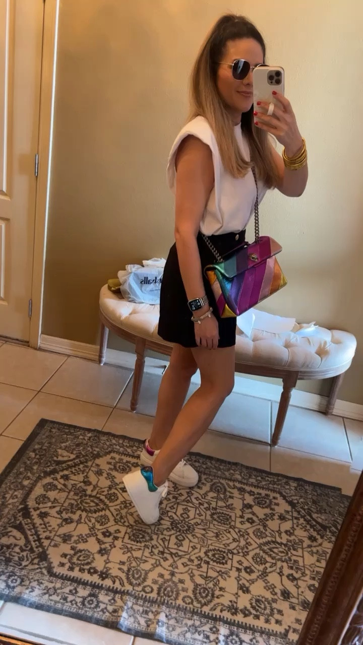 Spring outfit
Kurt Geiger, rainbow handbag 
Matching platform sneakers 
White 
Budhagirl gold bangle bracelets 
Quay black and gold metal oversized sunglasses 
Two-tone Apple Watch band 
Silver 
Gold 
White sleeveless, shoulder pad, T-shirt 

#LTKshoecrush #LTKSeasonal #LTKitbag