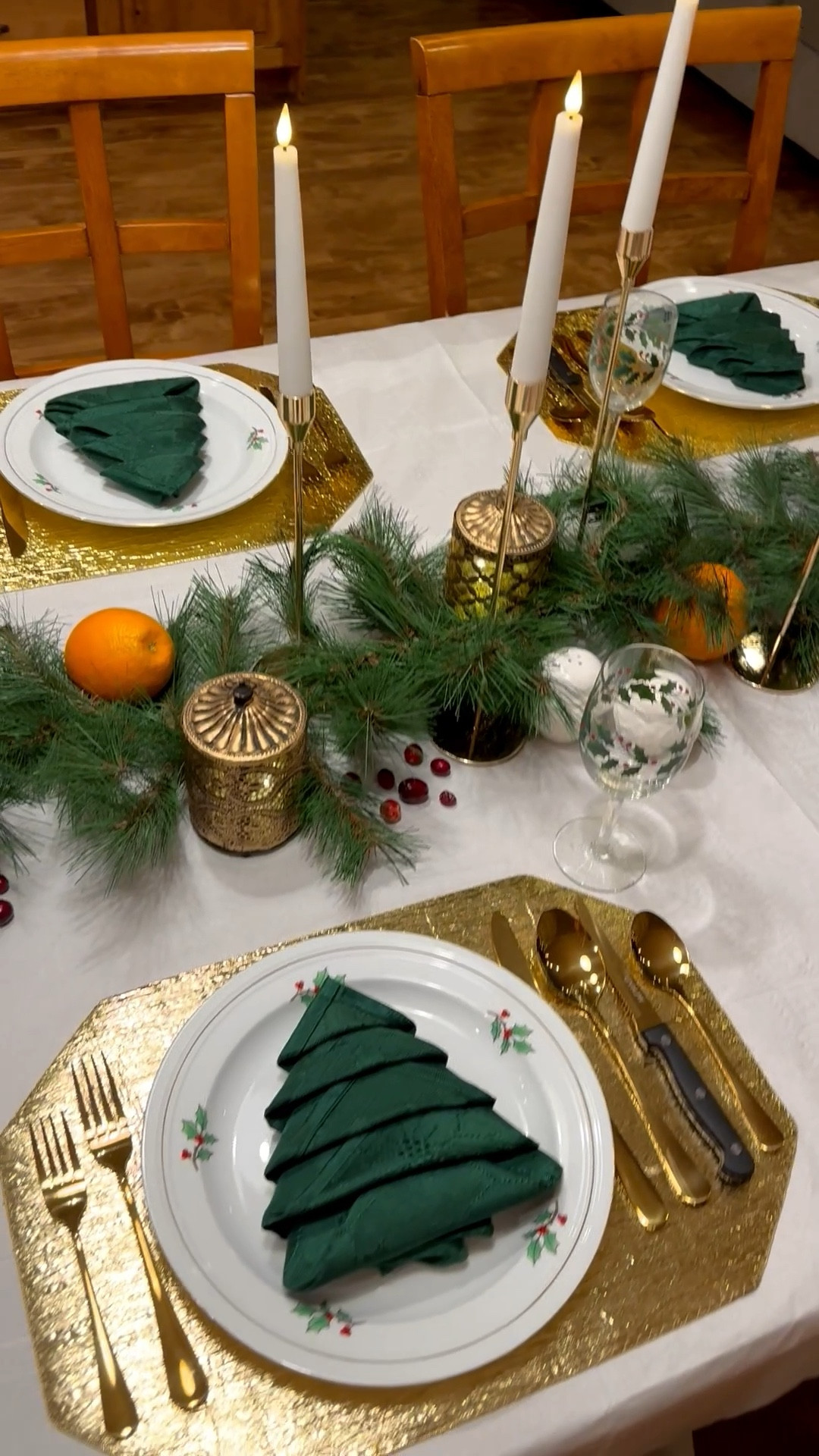 ✨🎄 Dreaming up the ultimate cozy-chic Christmas dinner party? This gorgeous holiday tablescape is giving all the festive Pinterest vibes:

🕯️ Warm-glow LED flameless candles in elegant gold candlestick holders
🌲 Lush pine garland with real oranges & cranberries adding pops of color and tucked around mini lanterns + Christmas tree-print gold rimmed dinner plates
🍷 Shimmering gold flatware, crystal-look mistletoe wine glasses, and soft green silky napkins for that classic red-green-gold palette

Whether you’re hosting Friends-mas, a holiday dinner party, or just want that “straight-out-of-a-Hallmark-movie” vibe, this magical Christmas centerpiece brings cozy glow + timeless sparkle to every tablescape. Perfect for mantel, dining room, or buffet table styling—it’s the holiday table look everyone’s saving to their mood boards. ✨

#LTKHome #LTKSeasonal #LTKFamily