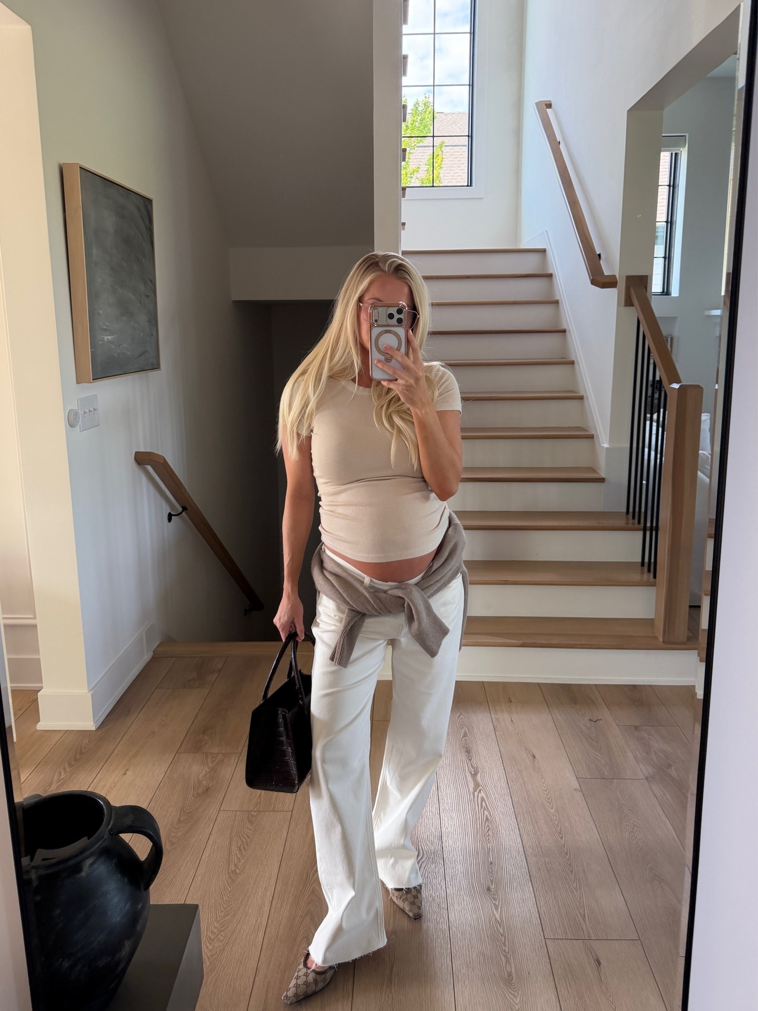 Wearing a medium in top, 31 in jeans (sized up for pregnancy- cut the bottom for a frayed hem), med sweater (tied on my waist), shoes are tts, linked similar bags! #kathleenpost

Casual guy chic outfit, spring transition look, spring outfit 2026, bump friendly, maternity look

#LTKootd #LTKSeasonal #LTKBump