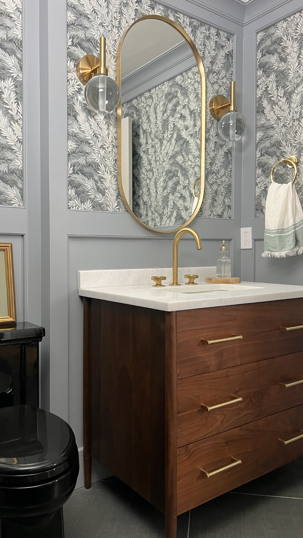 Half bathroom, patterned wallpaper, bathroom vanity, gold accents, metal accents, hand towel, bathroom styling, guest bathroom, sink, towel ring, bathroom hardware, interior design, home decor 

#LTKfindsunder50 #LTKfindsunder100 #LTKhome