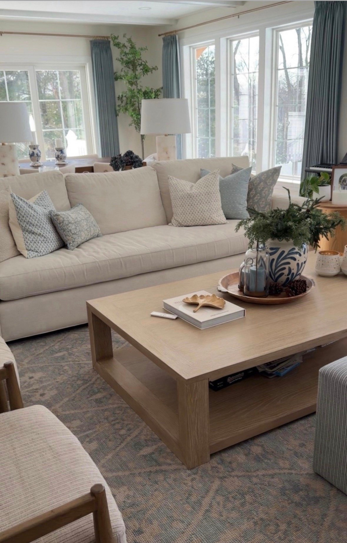 Modern coastal meets timeless elegance! Obsessed with the creamy whites, soft blues, and warm wood in our family room!

#LTKHome