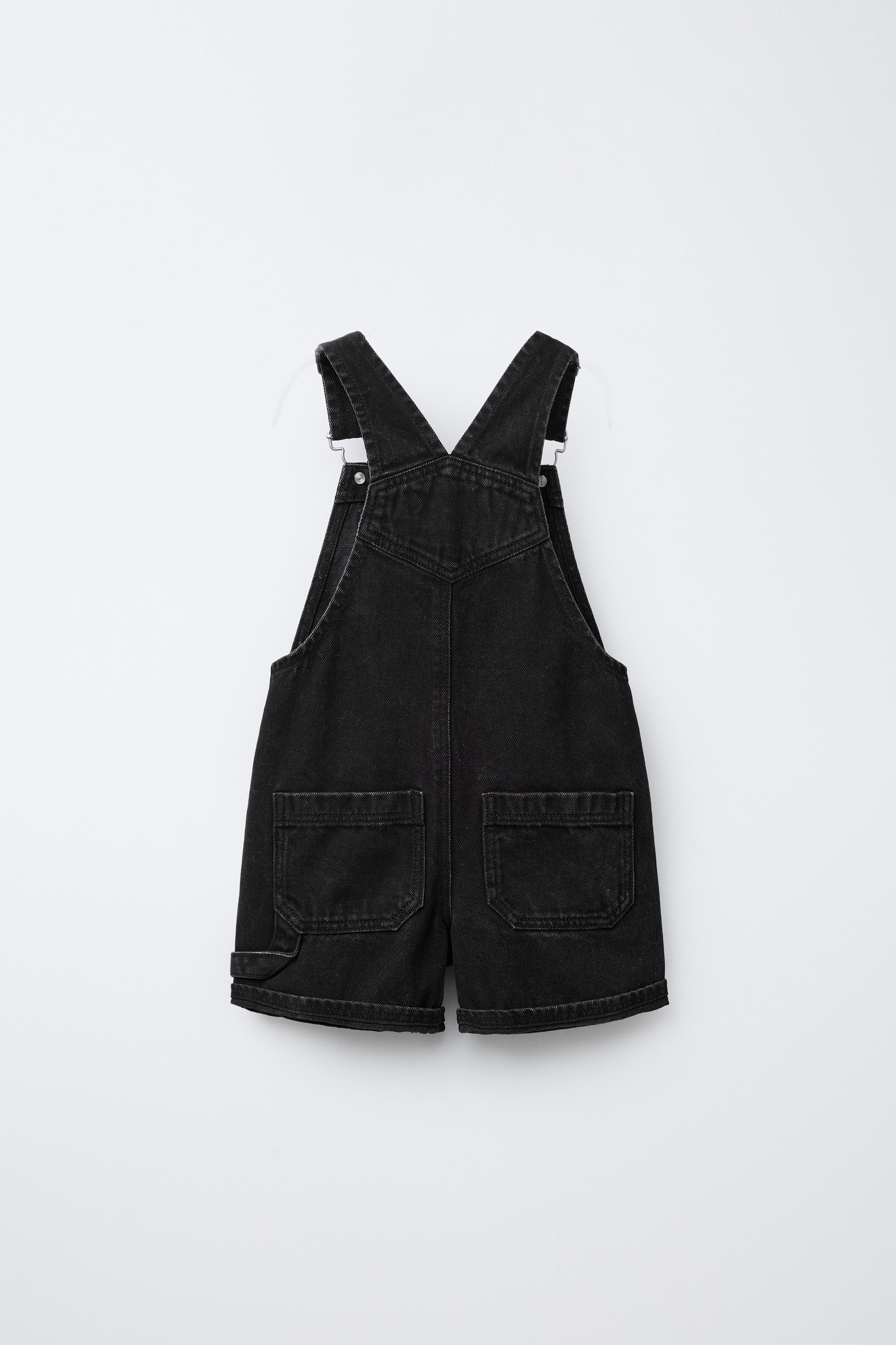 Short denim overalls with a straight neckline and front bib with buckle closure. Snap buttons at ... | Zara US
