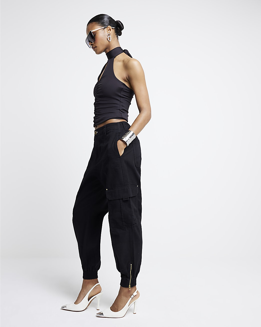 Black zip cuffed cargo trousers | River Island (UK & IE)