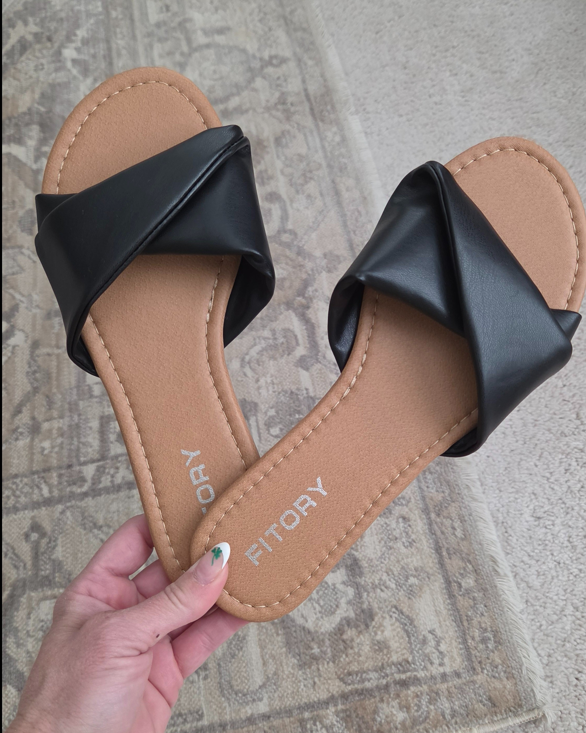 These black twisted slide sandals provide a sleek and modern look for your casual everyday wardrobe. The cushioned sole and stylish design make them an easy go-to for all-day comfort.#womensshoes #summerstyle #amazonfashion #sandals

#LTKTravel #LTKSwim #LTKSeasonal