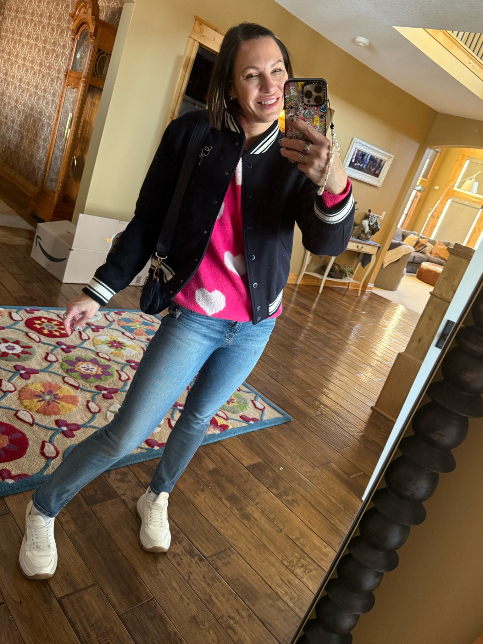 Valentine’s Day day outfit inspired! Golden goose jacket- size small. Pink heart sweater- size small. Straight leg jeans-size 25. Prada sneakers- size 7.5 

#LTKSeasonal #LTKStyleTip #LTKShoeCrush